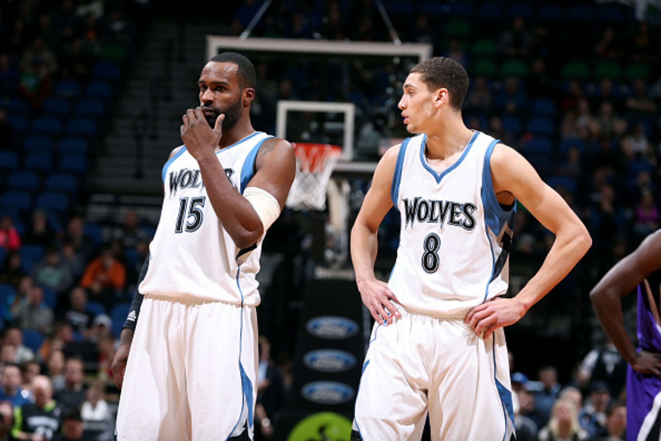 MINNEAPOLIS, MN - JANUARY 1: Shabazz Muhammad #15 and Zach LaVine #8 of the Minnesota Timberwolves speak during a game against the Sacramento Kings on January 1, 2015 at Target Center in Minneapolis, Minnesota. NOTE TO USER: User expressly acknowledges an