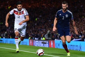 GLASGOW, SCOTLAND - SEPTEMBER 7 : Charlie Mulgrew of Scotland challenges Emre Can of Germany during the EURO 2016 Qualifier between Scotland and Germany at Hamden Park on September 7, 2015 in Glasgow, Scotland. (Photo by Mark Runnacles/Getty Images)