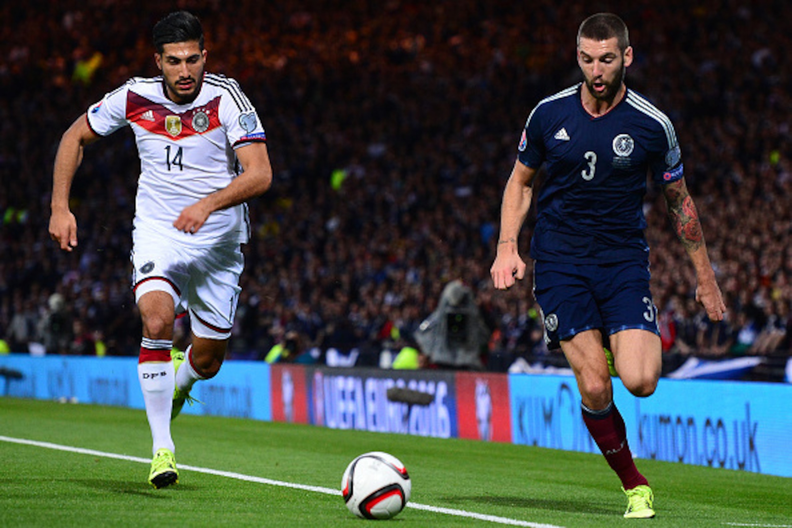 GLASGOW, SCOTLAND - SEPTEMBER 7 : Charlie Mulgrew of Scotland challenges Emre Can of Germany during the EURO 2016 Qualifier between Scotland and Germany at Hamden Park on September 7, 2015 in Glasgow, Scotland. (Photo by Mark Runnacles/Getty Images)