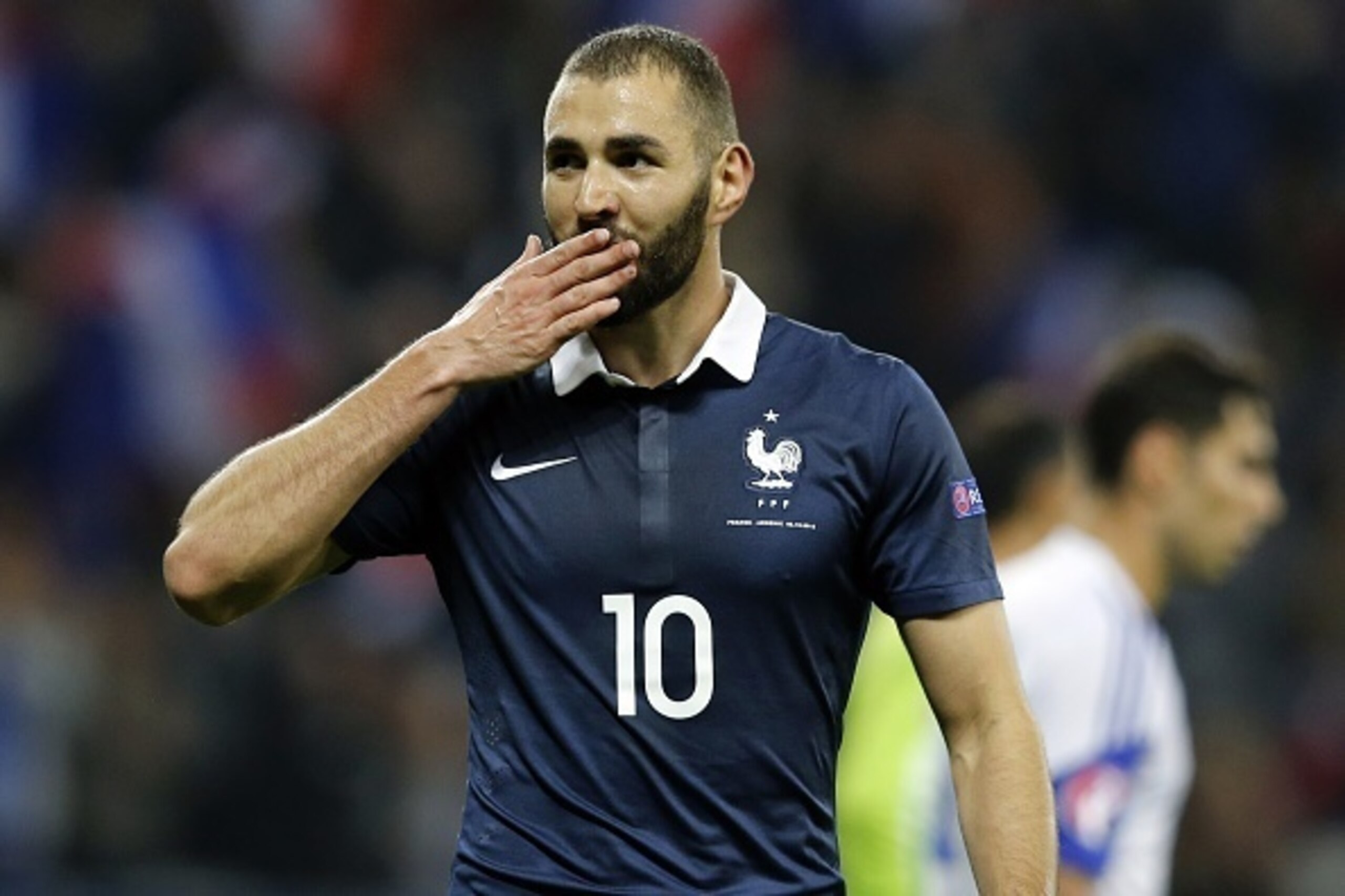 France's forward Karim Benzema celebrates after scoring a goal during the friendly football match between France and Armenia on October 8, 2015 at the Allianz Riviera stadium in Nice, southeastern France. AFP PHOTO / VALERY HACHE        (Photo credit shou