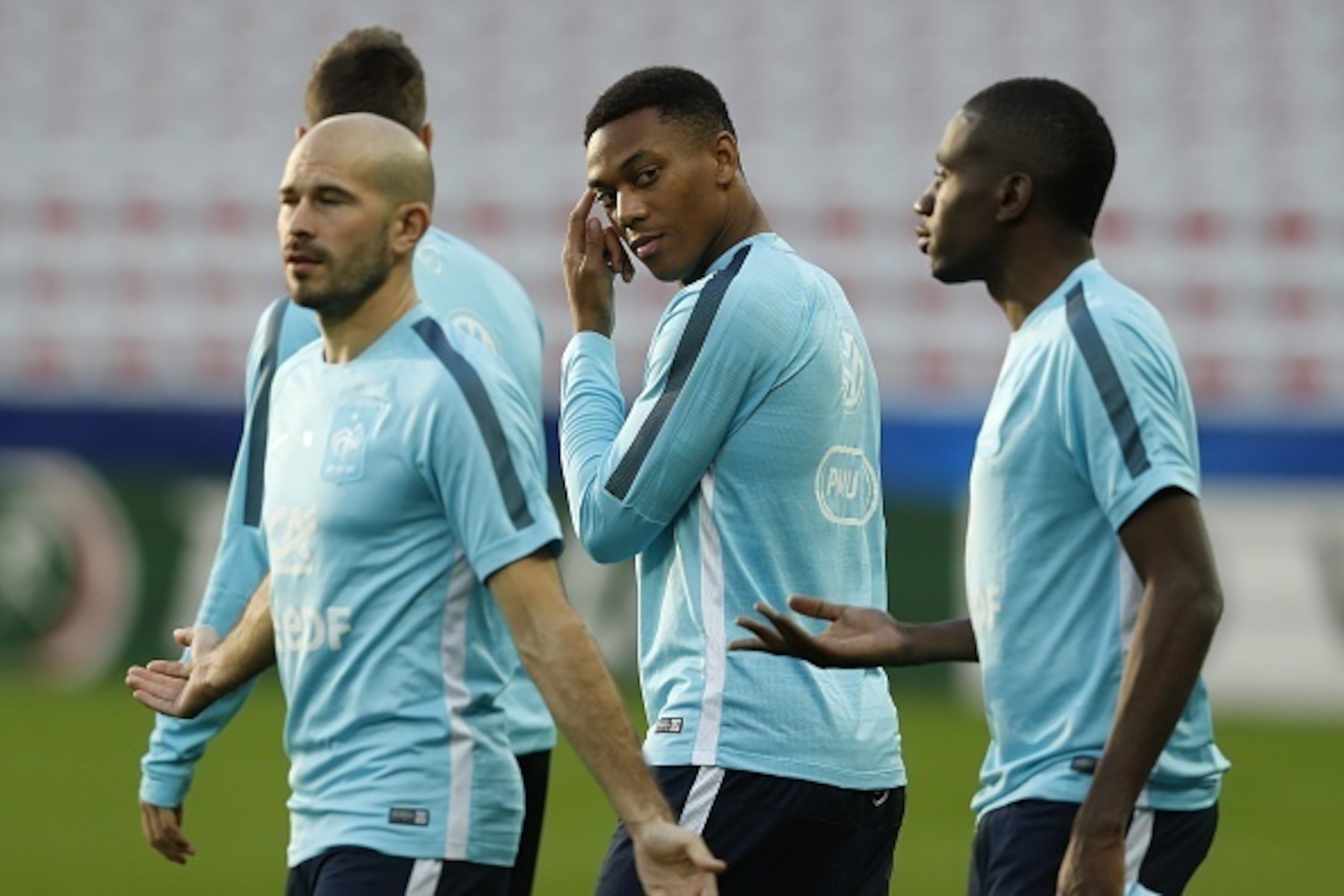(From L) France's national football team defender Christophe Jallet, forward Anthony Martial and midfielder Blaise Matuidi attend a training session on the eve of the friendly football match France vs Armenia  on October 7, 2015 at the Allianz Riviera sta