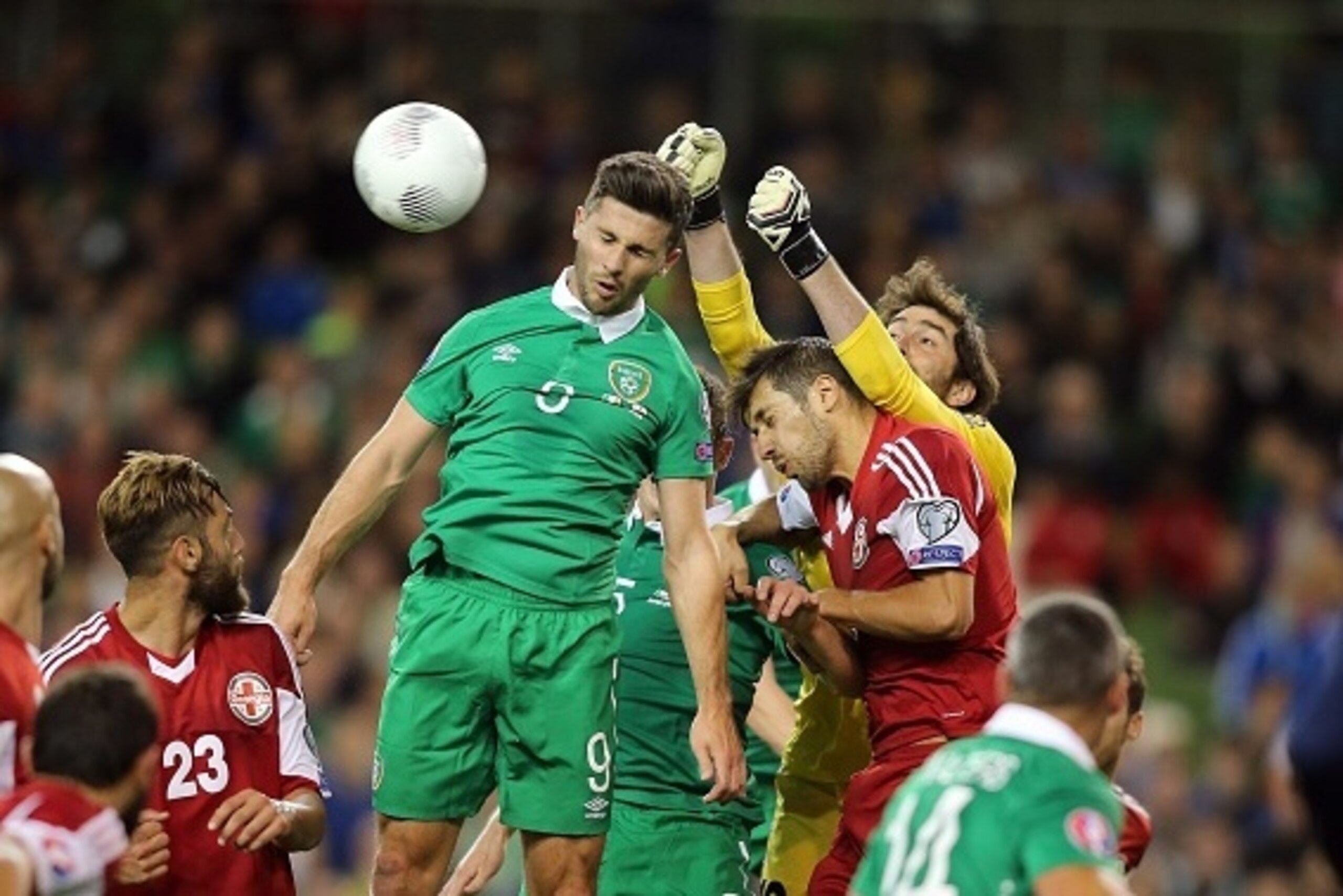 Republic of Ireland's striker Shane Long (centre left) jumps for the ball as Georgia's goalkeeper Nukri Revishvili punches clear during the Euro 2016 qualifying group D football match between Republic of Ireland and Georgia at Aviva Stadium in Dublin on S Republic of Ireland's striker Shane Long (centre left) jumps for the ball as Georgia's goalkeeper Nukri Revishvili punches clear during the Euro 2016 qualifying group D football match between Republic of Ireland and Georgia at Aviva Stadium in Dublin on S