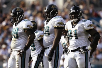 JACKSONVILLE, FL - OCTOBER 6:  (L to R) Marcus Stroud #99, John Henderson #98 and Marco Coleman #91 (R) of the Philadelphia Eagles take a breather against the Jacksonville Jaguars on October 6, 2002 at Alltel Stadium in Jacksonville, Florida.  (Photo by A