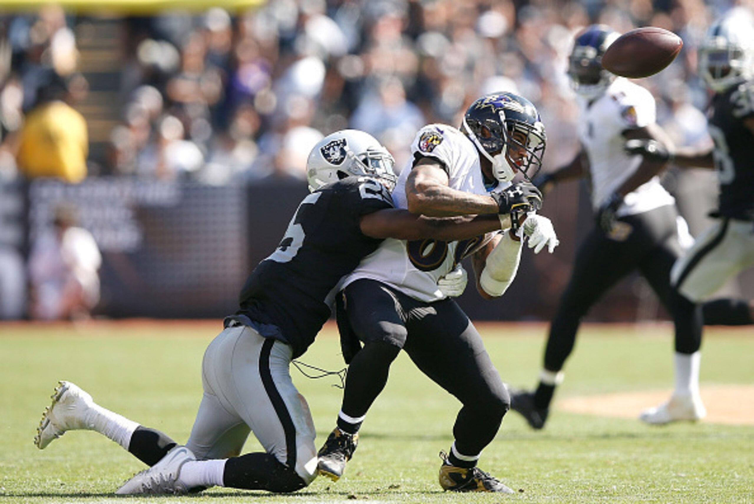 OAKLAND, CA - SEPTEMBER 20:  D.J. Hayden #25 of the Oakland Raiders breaks a pass intended for Steve Smith #89 of the Baltimore Ravens in the third quarter at Oakland-Alameda County Coliseum on September 20, 2015 in Oakland, California.  (Photo by Ezra Sh