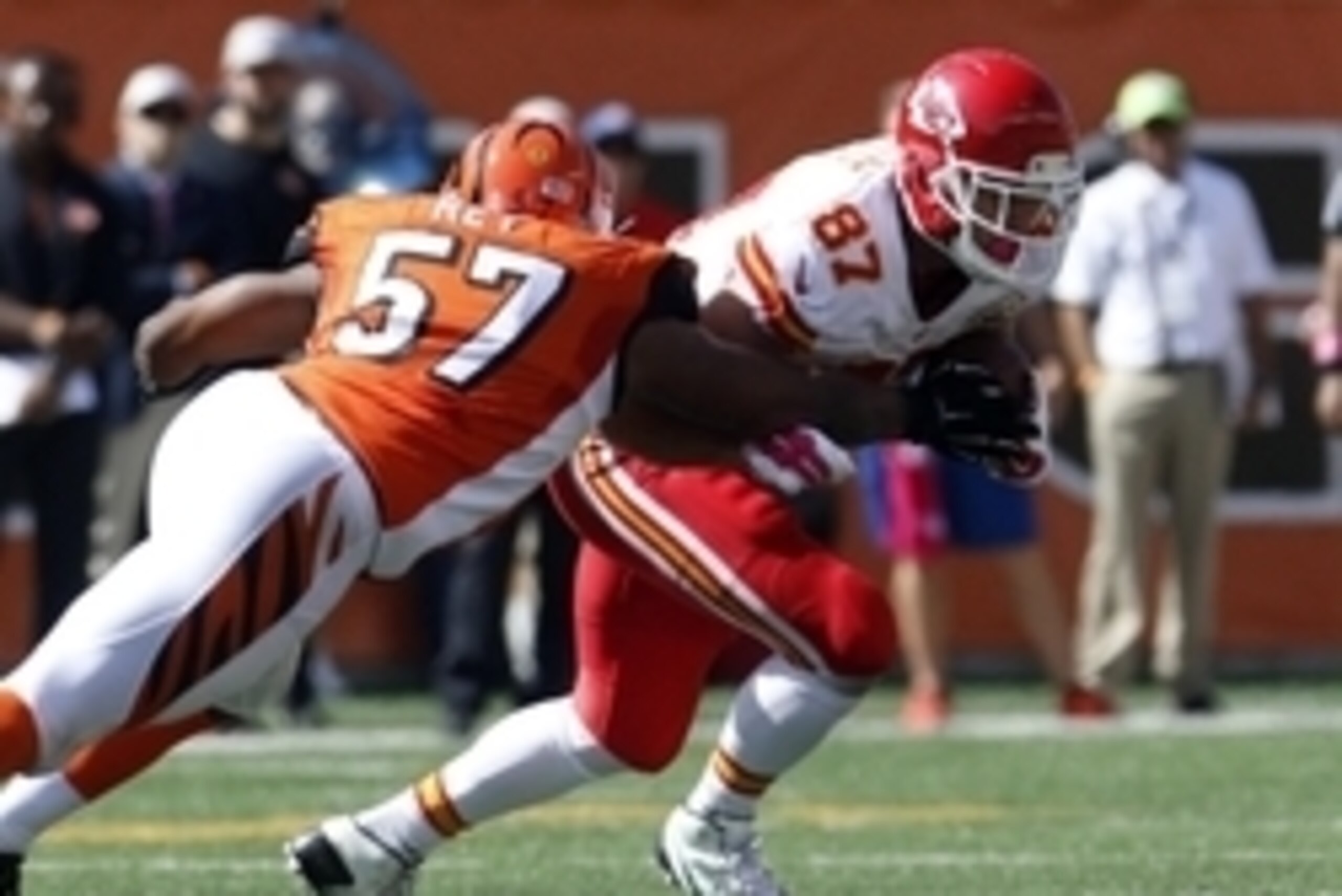 Oct 4, 2015; Cincinnati, OH, USA; Cincinnati Bengals linebacker Vincent Rey (57) tackles Kansas City Chiefs tight end Travis Kelce (87) in the second half at Paul Brown Stadium. Cincinnati defeated Kansas City 36-21. Mandatory Credit: Mark Zerof-USA TODAY Oct 4, 2015; Cincinnati, OH, USA; Cincinnati Bengals linebacker Vincent Rey (57) tackles Kansas City Chiefs tight end Travis Kelce (87) in the second half at Paul Brown Stadium. Cincinnati defeated Kansas City 36-21. Mandatory Credit: Mark Zerof-USA TODAY