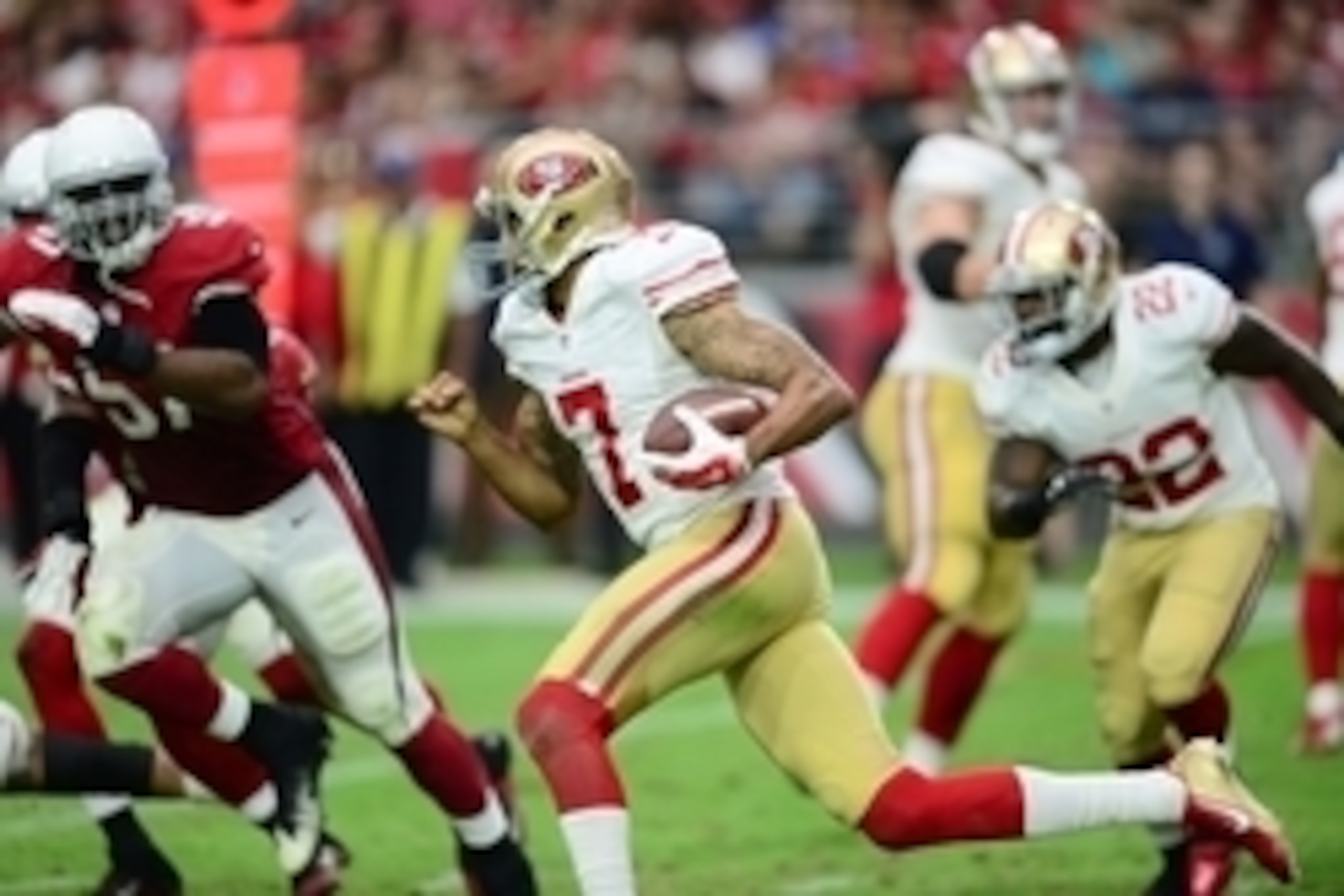 Sep 27, 2015; Glendale, AZ, USA; San Francisco 49ers quarterback Colin Kaepernick (7) runs with the ball against the Arizona Cardinals at University of Phoenix Stadium. Mandatory Credit: Joe Camporeale-USA TODAY Sports Sep 27, 2015; Glendale, AZ, USA; San Francisco 49ers quarterback Colin Kaepernick (7) runs with the ball against the Arizona Cardinals at University of Phoenix Stadium. Mandatory Credit: Joe Camporeale-USA TODAY Sports