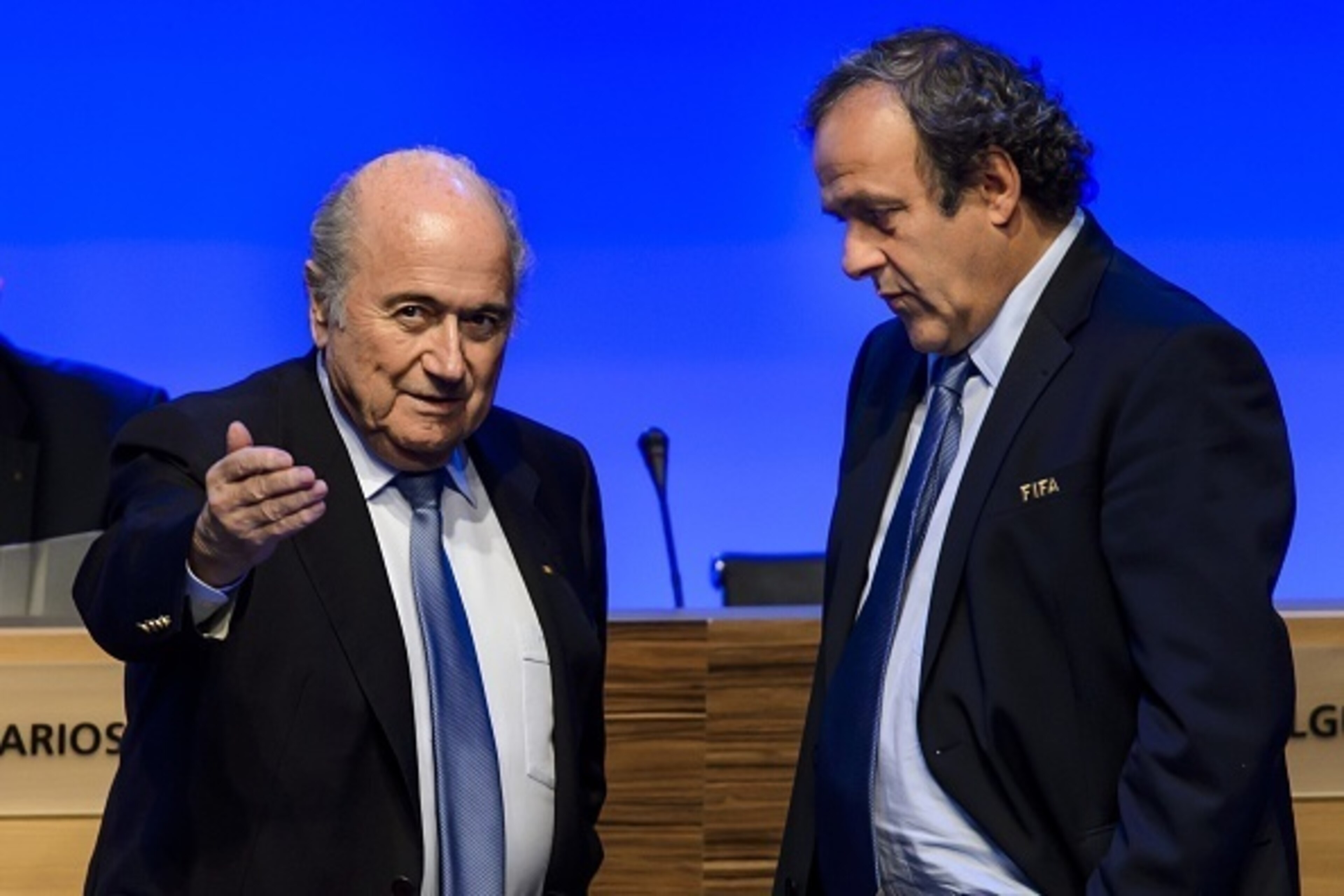 FIFA president Joseph Blatter (L) talks to UEFA president Michel Platini during the 64th FIFA congress on June 11, 2014 in Sao Paulo, on the eve of the opening match of the 2014 FIFA World Cup in Brazil.     AFP PHOTO / FABRICE COFFRINI        (Photo cred