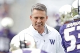 Sep 19, 2015; Seattle, WA, USA; Washington Huskies head coach Chris Petersen talks with his players before the start of a game against the Utah State Aggies at Husky Stadium. Mandatory Credit: Jennifer Buchanan-USA TODAY Sports