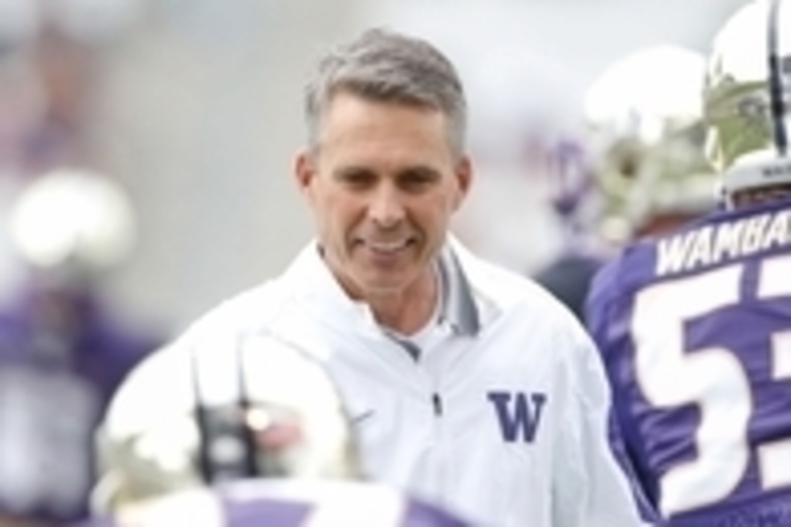 Sep 19, 2015; Seattle, WA, USA; Washington Huskies head coach Chris Petersen talks with his players before the start of a game against the Utah State Aggies at Husky Stadium. Mandatory Credit: Jennifer Buchanan-USA TODAY Sports