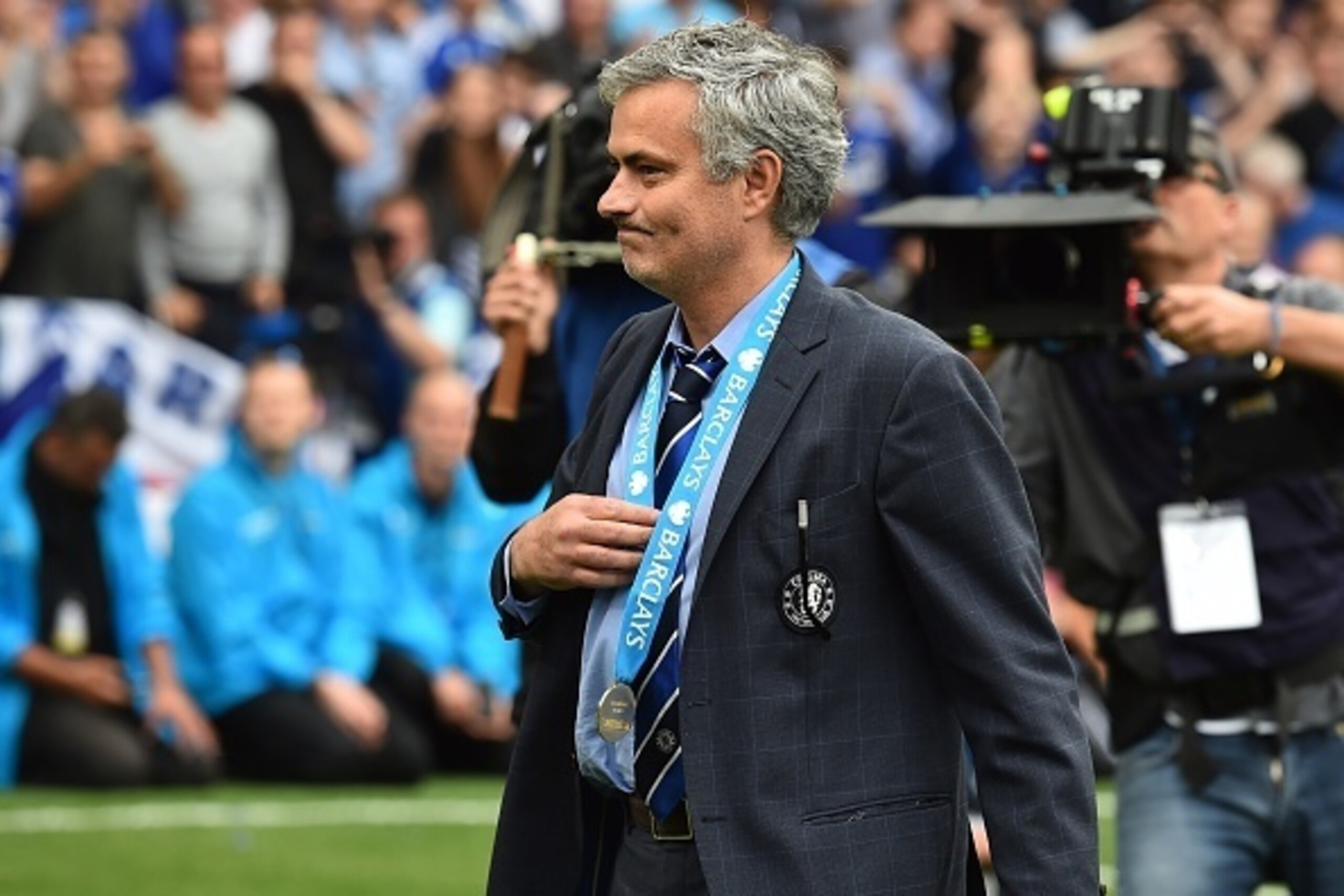 Chelsea's Portuguese manager Jose Mourinho wears his winners' medal following the Premier League trophy presentation after the English Premier League football match between Chelsea and Sunderland at Stamford Bridge in London on May 24, 2015. Chelsea were 