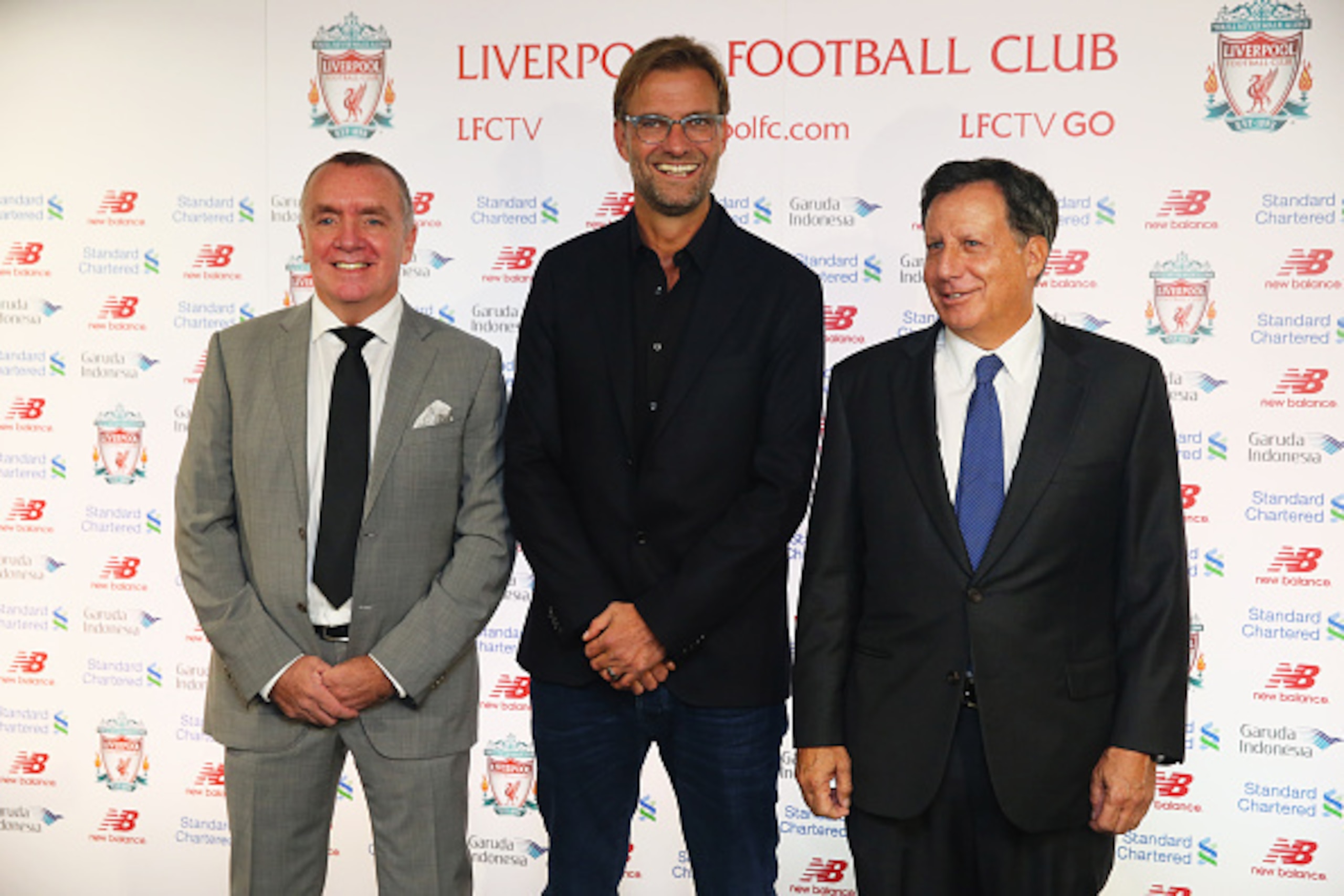 LIVERPOOL, ENGLAND - OCTOBER 09:  Jurgen Klopp (C) is unveiled as the new manager of Liverpool FC alongside Ian Ayre (L) the Chief Executive Officer of Liverpool and Tom Werner (R) the Liverpool Chairman during a press conference at Anfield on October 9, 