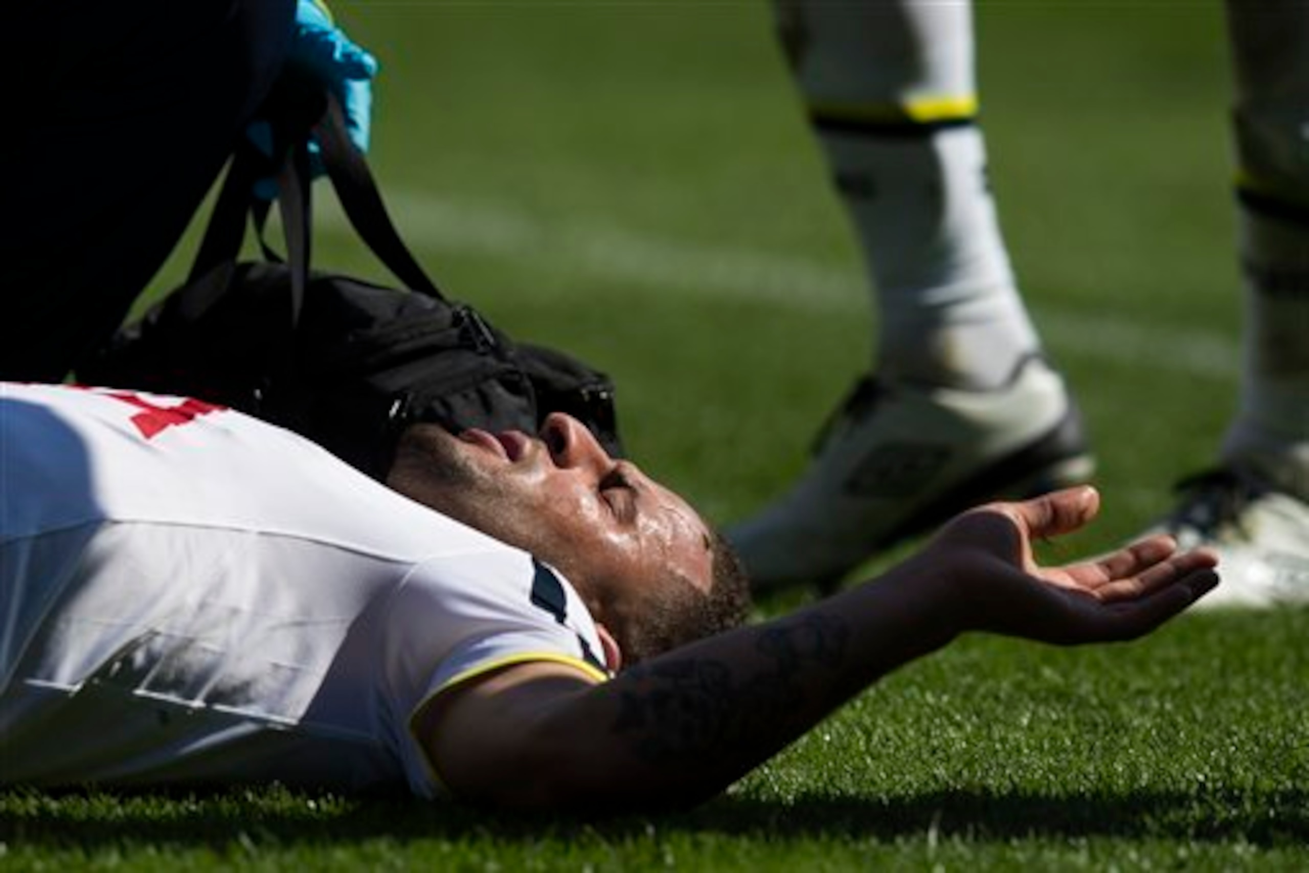 Walker lies injured on the Burnley pitch shortly after making his England comeback. His season would be over prematurely again.