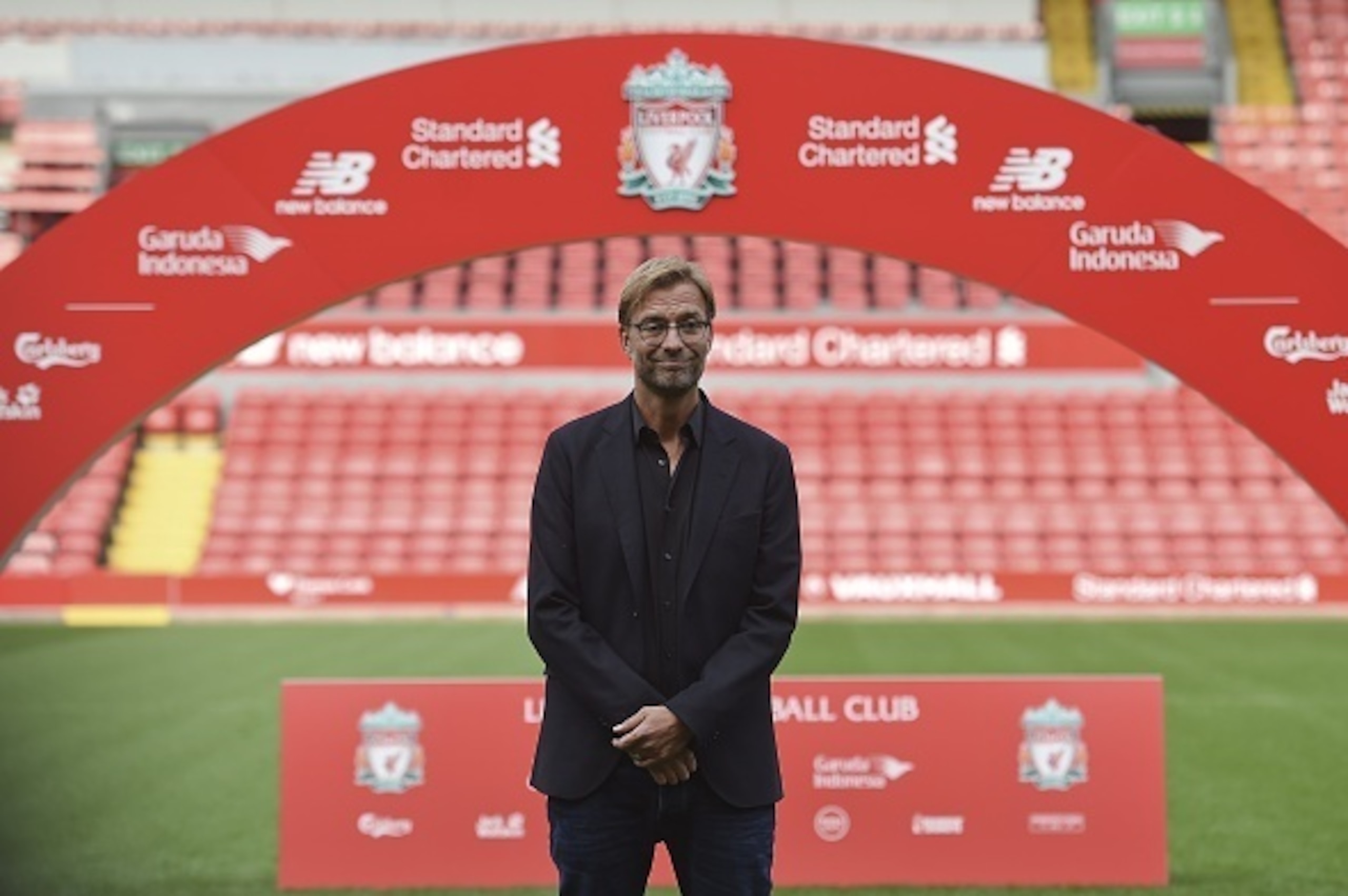 Liverpool's new German manager Jurgen Klopp poses on the pitch after a press conference to announce his new appointment at Anfield in Liverpool, northwest England, on October 9, 2015. Klopp described his job as 'the biggest challenge' in world football on