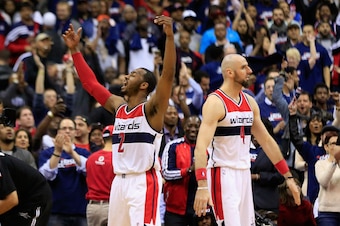 WASHINGTON, DC - APRIL 24:  John Wall #2 of the Washington Wizards celebrates during the closing seconds of their 106-99 win over the Toronto Raptors during Game Three of the Eastern Conference Quarterfinals of the NBA playoffs at Verizon Center on April
