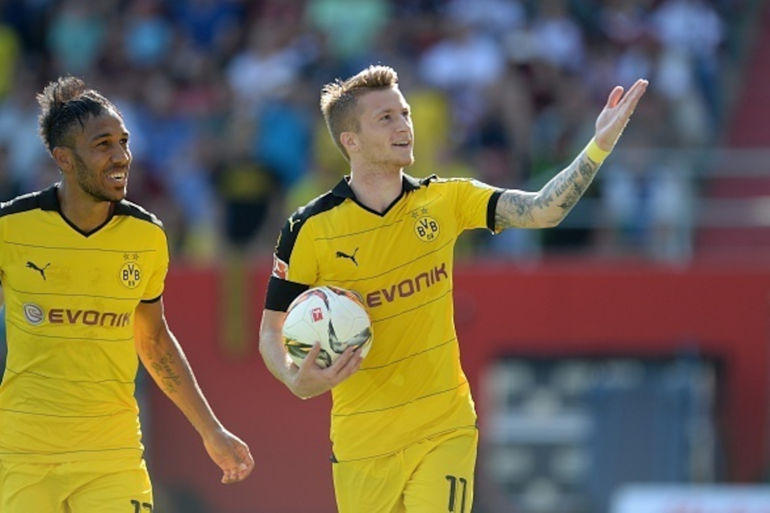 Dortmund's Gabonese striker Pierre-Emerick Aubameyang (L) and his teammate Dortmund's midfielder Marca Reus (R) celebrate after the penalty kick goal for Dortmund during the German first division Bundesliga football match FC Ingolstadt 04 vs Borussia Dort