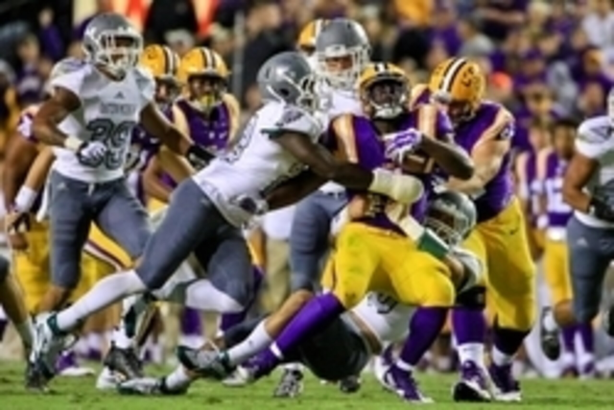 Oct 3, 2015; Baton Rouge, LA, USA; LSU Tigers running back Leonard Fournette (7) is tackled by Eastern Michigan Eagles defensive back Anthony Brown (22) during the second quarter of a game at Tiger Stadium. Mandatory Credit: Derick E. Hingle-USA TODAY Spo