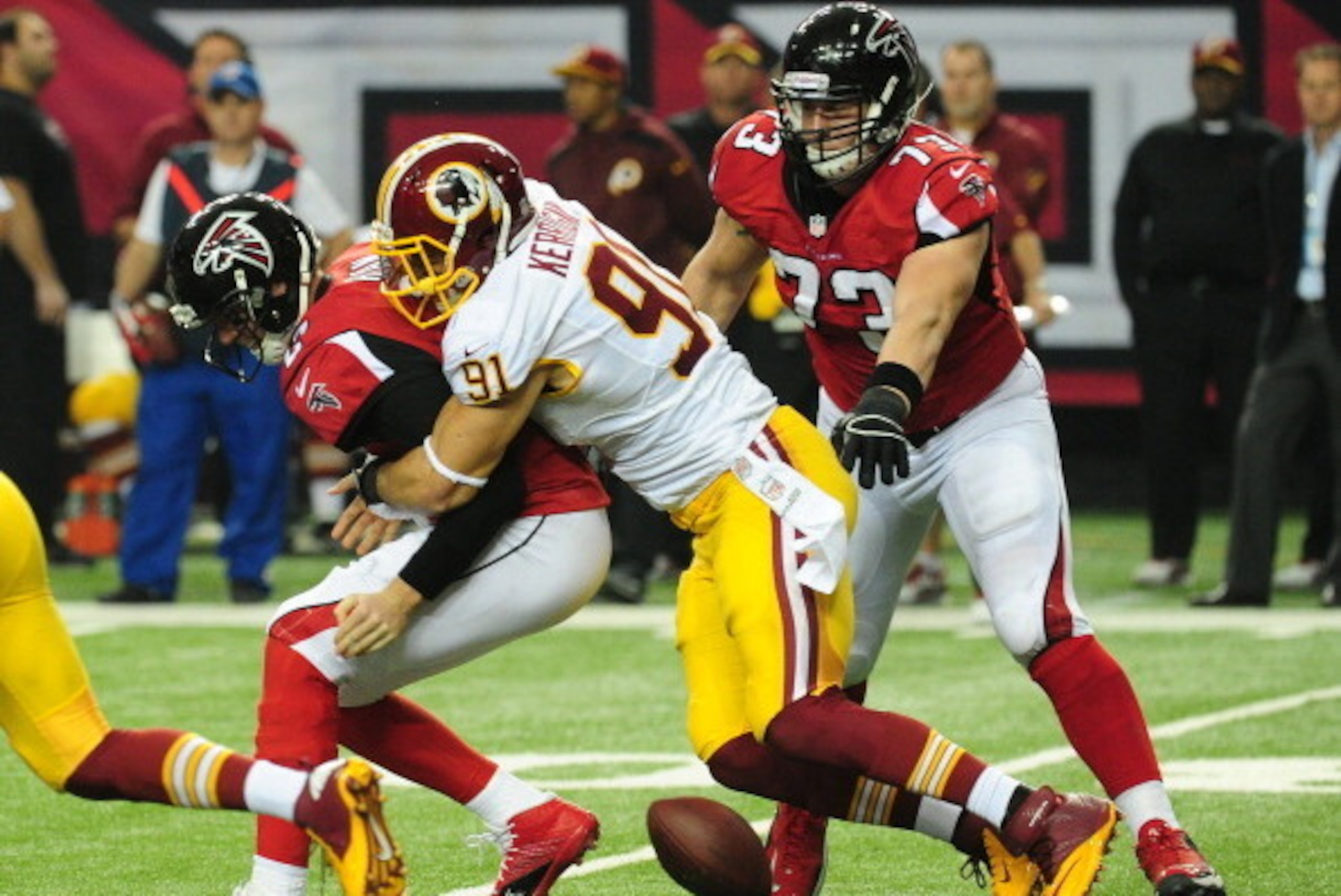 ATLANTA, GA - DECEMBER 15: Matt Ryan #2 of the Atlanta Falcons fumbles as he is hit by Ryan Kerrigan #91 of the Washington Redskins at the Georgia Dome on December 15, 2013 in Atlanta, Georgia. (Photo by Scott Cunningham/Getty Images)