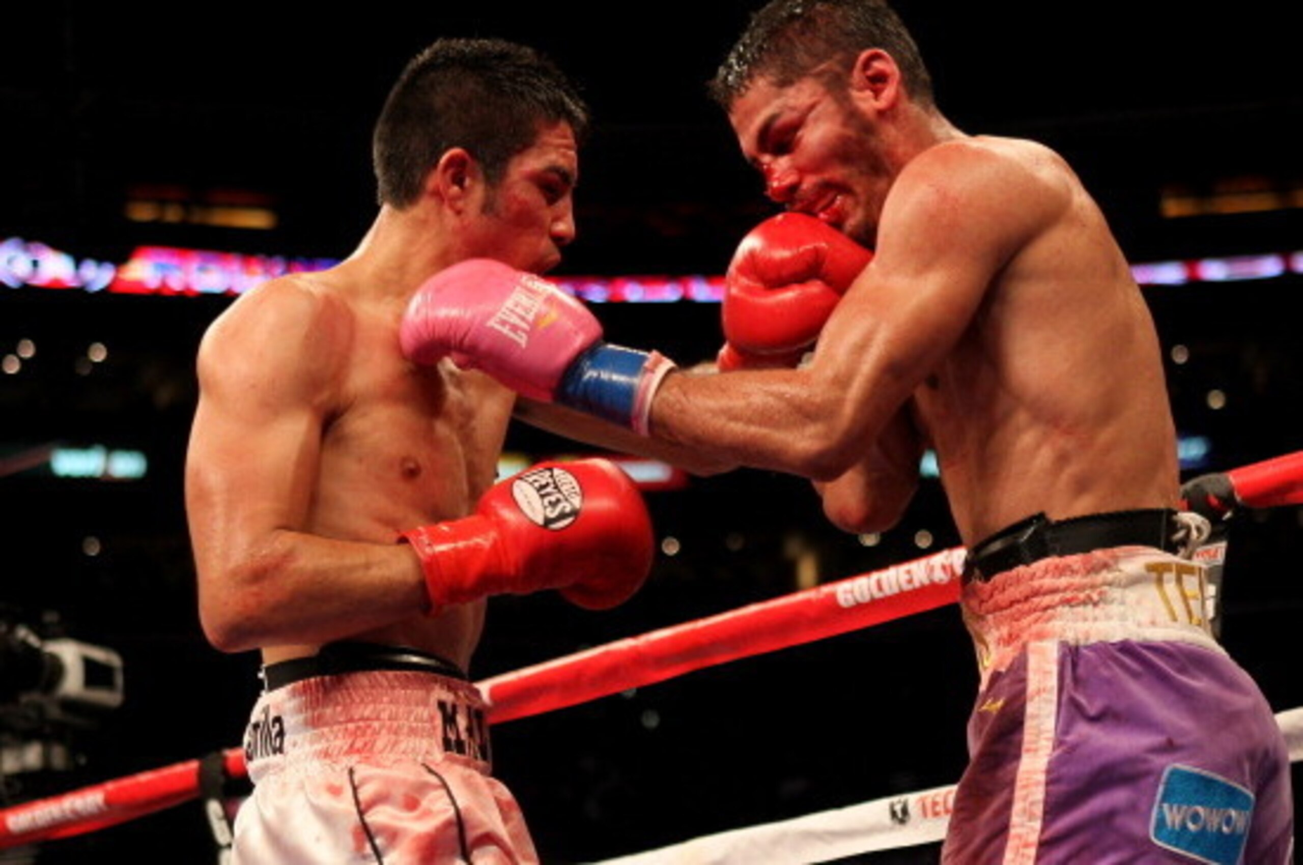 LOS ANGELES, CA - OCTOBER 15:  Antonio DeMarco of Mexico (L) lands a punch on Jorge Linares of Venezuela in their WBC lightweight title fight at Staples Center on October 15, 2011 in Los Angeles, California. DeMarco won in an eleventh round TKO.  (Photo b