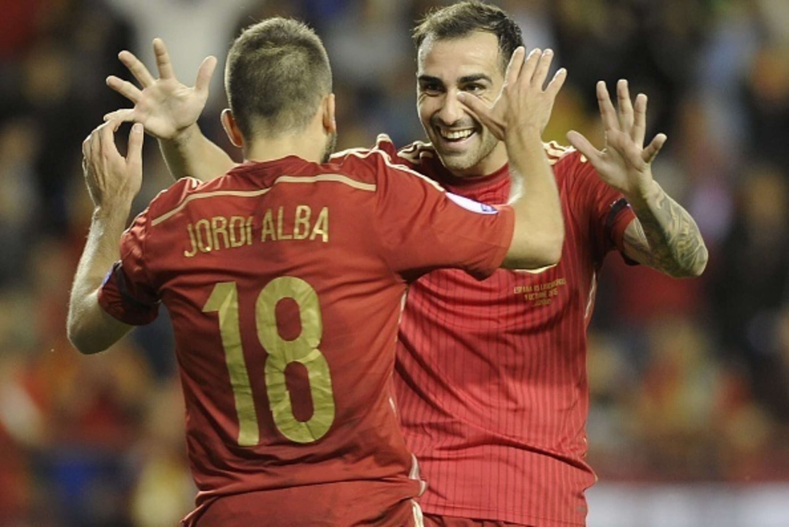 Spain's defender Jordi Alba (L) and forward Paco Alcacer celebrate after scoring during the Euro 2016 qualifying football match Spain vs Luxembourg at Las Gaunas stadium in Logrono on October 9, 2015. AFP PHOTO/  ANDER GILLENEA        (Photo credit should