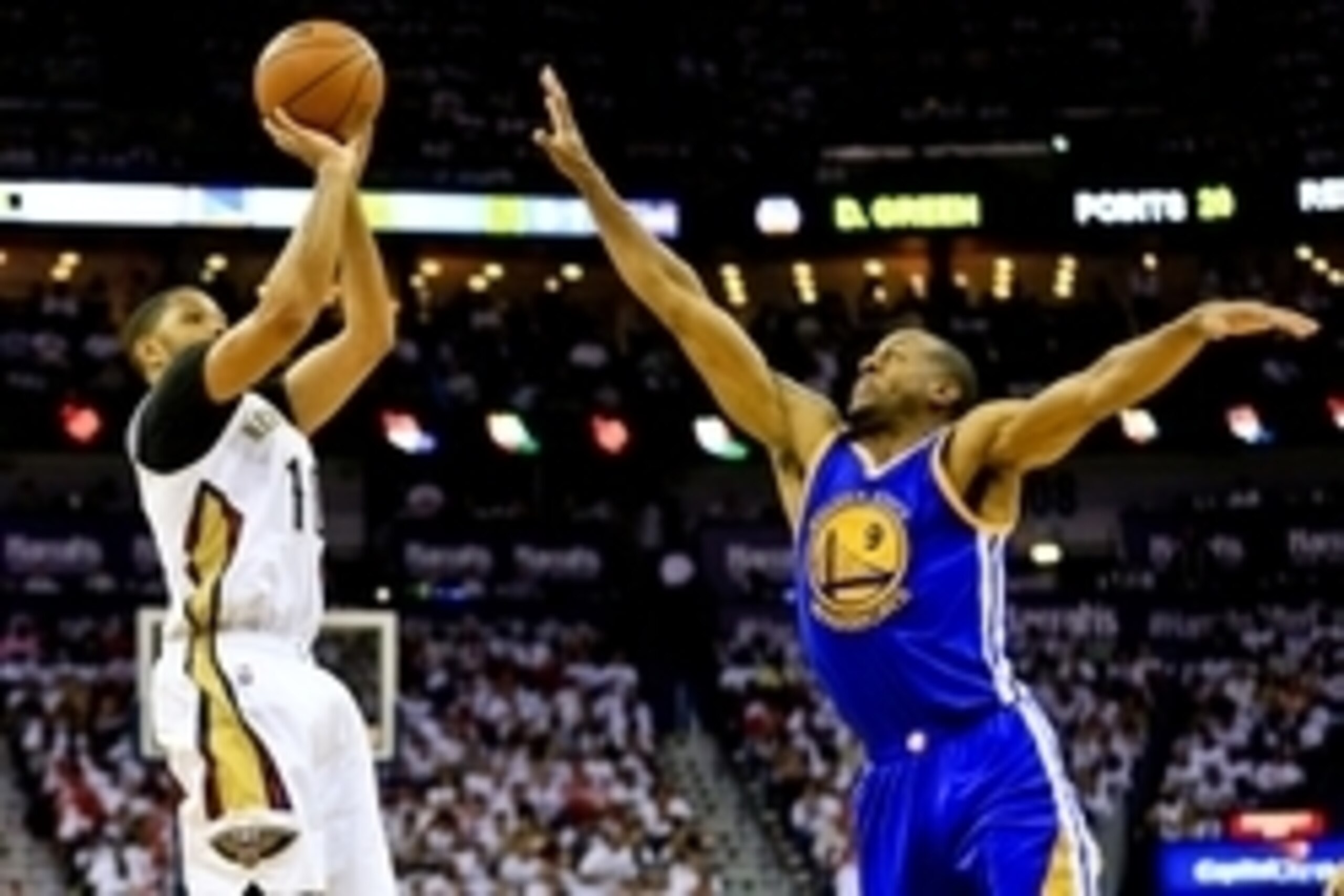 Apr 25, 2015; New Orleans, LA, USA; New Orleans Pelicans guard Eric Gordon (10) shoots over Golden State Warriors guard Andre Iguodala (9) during the second half in game four of the first round of the NBA Playoffs at the Smoothie King Center. The Warriors