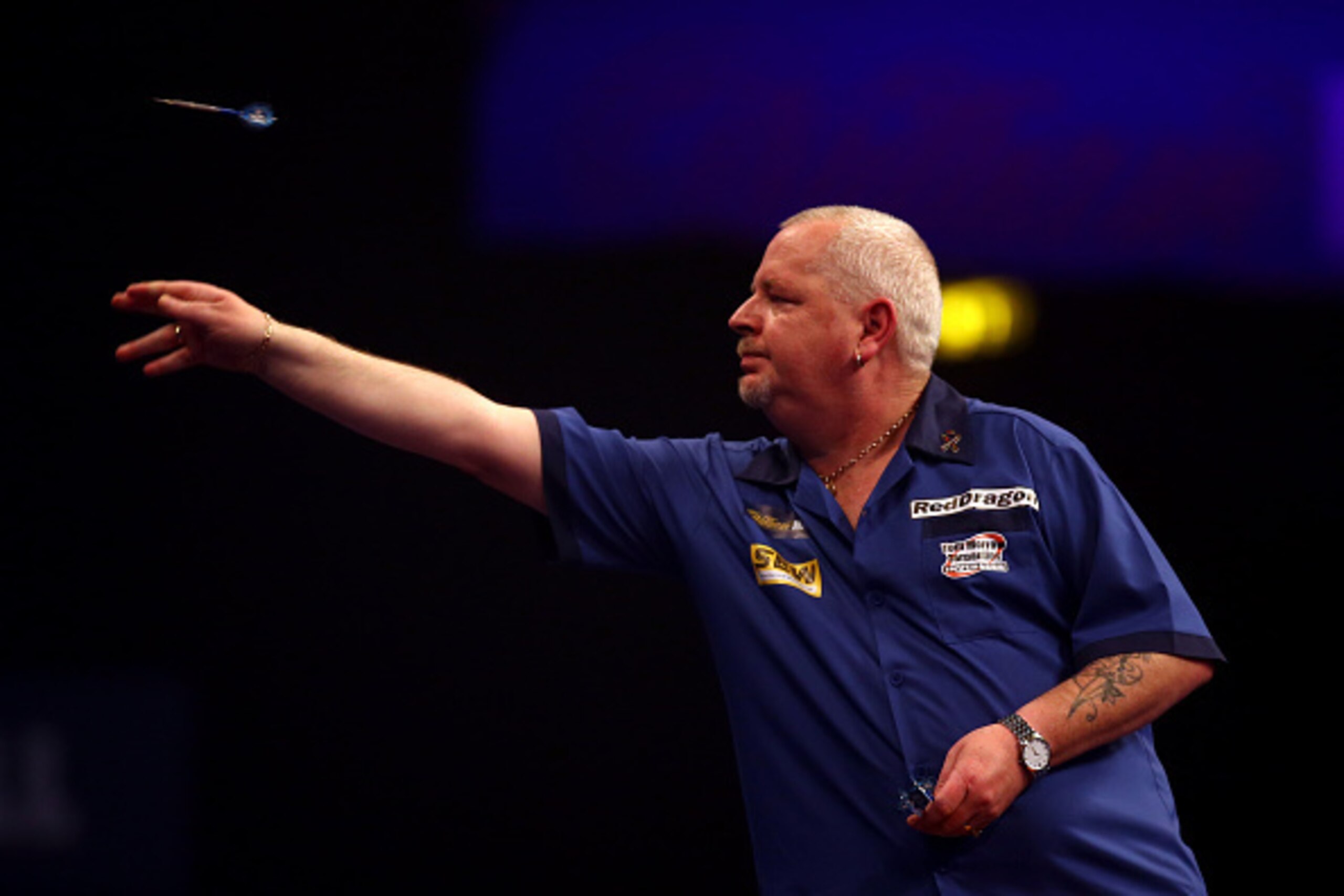 LONDON, ENGLAND - DECEMBER 29: Robert Thornton of Scotland in action during his third round match against Benito van de Pas of Holland during the William Hill PDC World Darts Championships on Day Nine at Alexandra Palace on December 29, 2014 in London, En