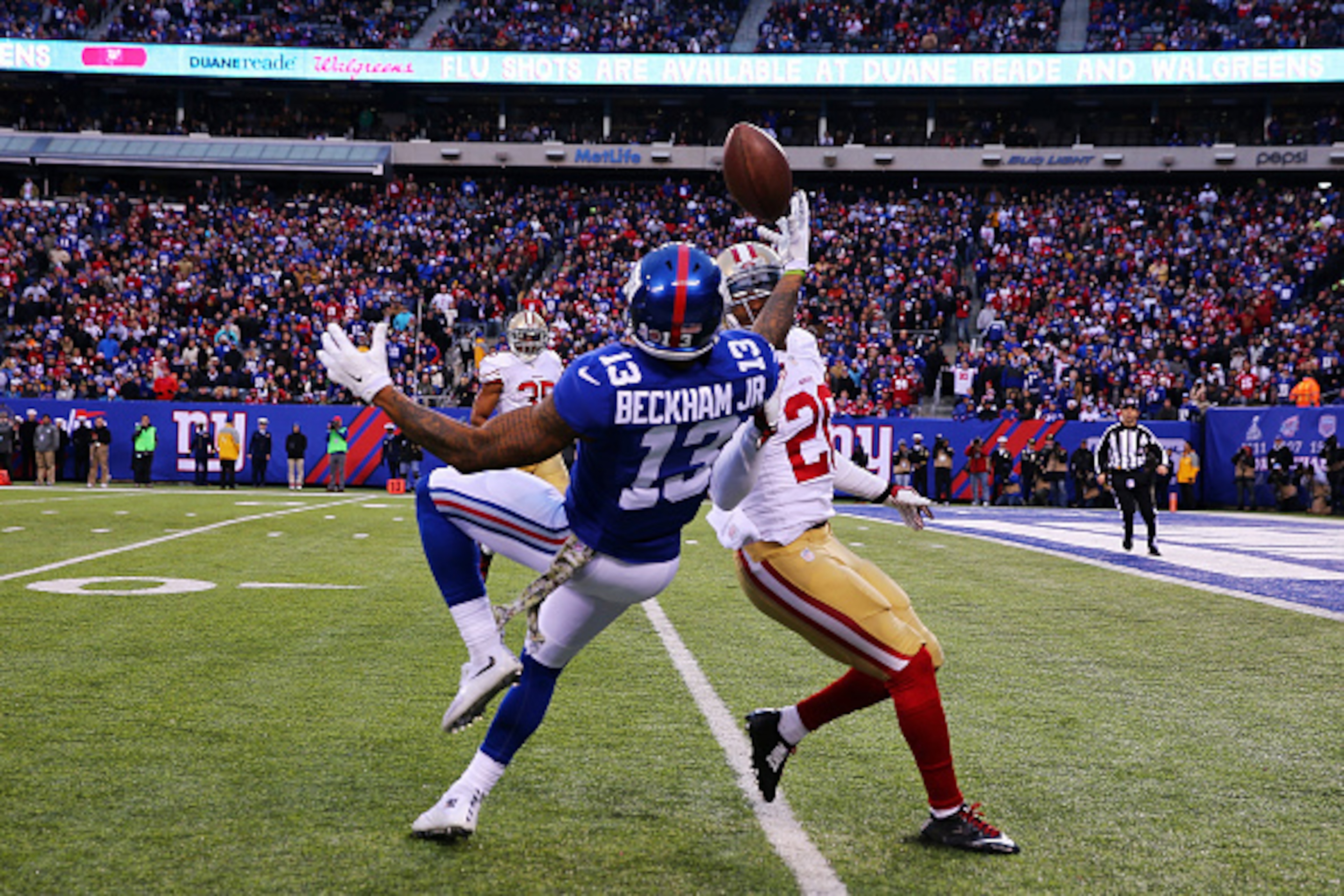EAST RUTHERFORD, NJ - NOVEMBER 16:  Odell Beckham #13 makes a catch against  Perrish Cox #20 of the San Francisco 49ers in the fourth quarter of the New York Giants at MetLife Stadium on November 16, 2014 in East Rutherford, New Jersey.  (Photo by Elsa/Ge