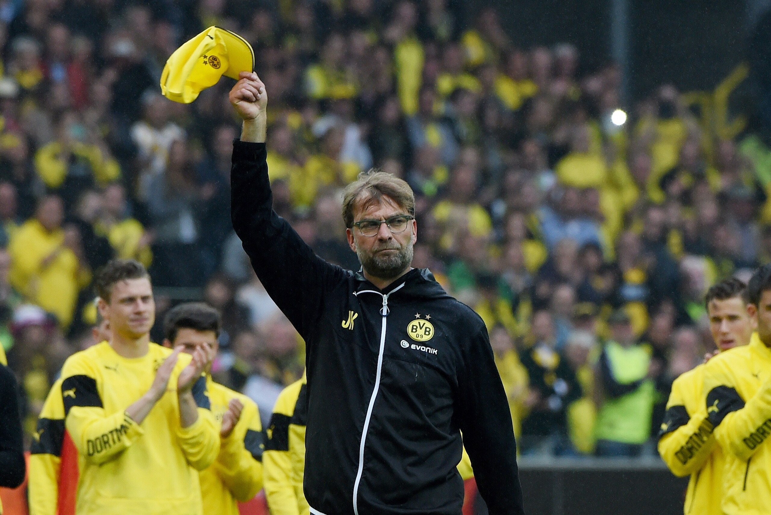 Dortmund's head coach Juergen Klopp and Dortmund's players celebrate after the German first division Bundesliga football match between Borussia Dortmund and SV Werder Bremen at the Signal Iduna Park in Dortmund, western Germany on May 23, 2015. Dortmund w