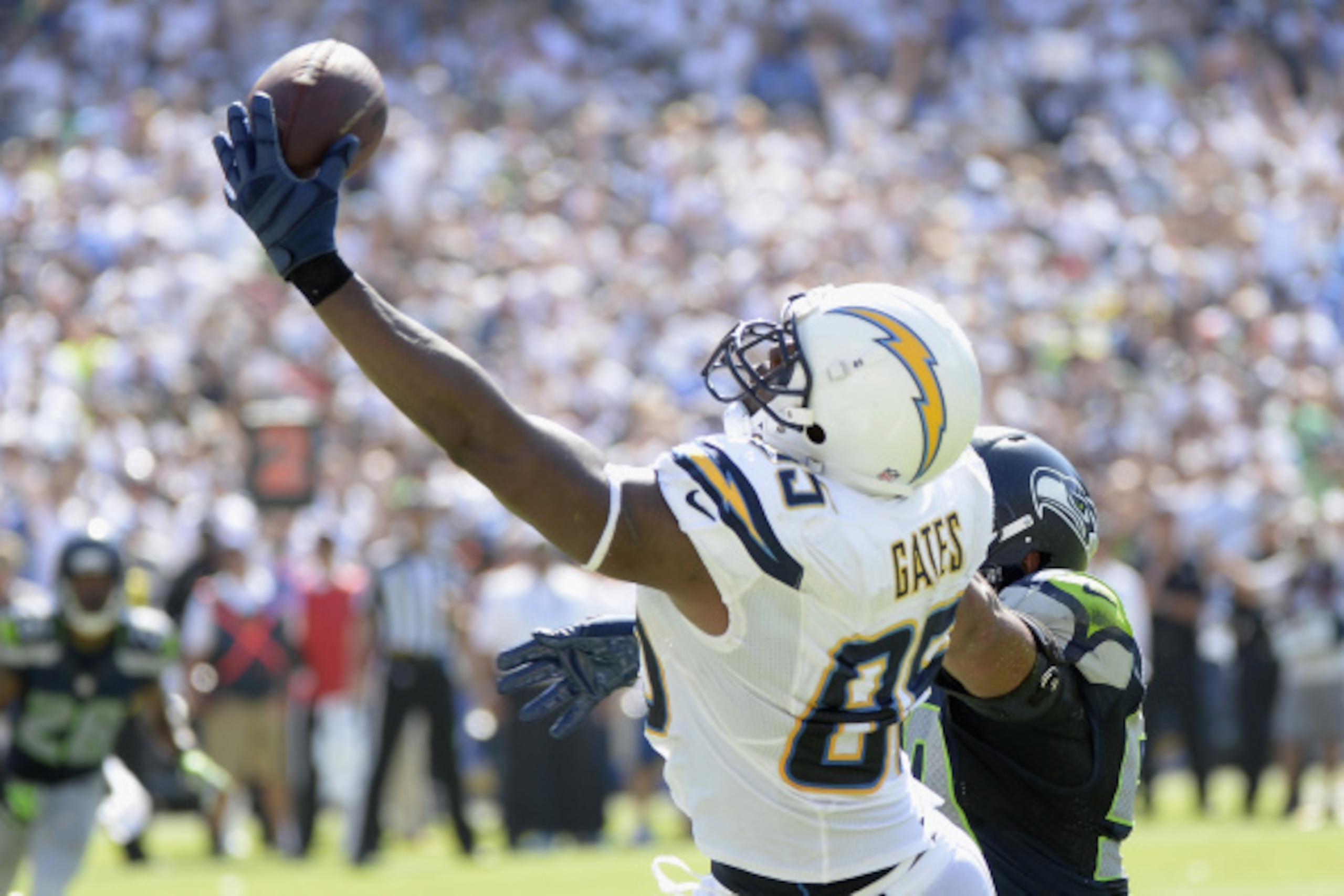 SAN DIEGO, CA - SEPTEMBER 14:  Tight end Antonio Gates #85 of the San Diego Chargers catches a touchdown pass while defended by outside linebacker K.J. Wright #50 of the Seattle Seahawks at Qualcomm Stadium on September 14, 2014 in San Diego, California. 