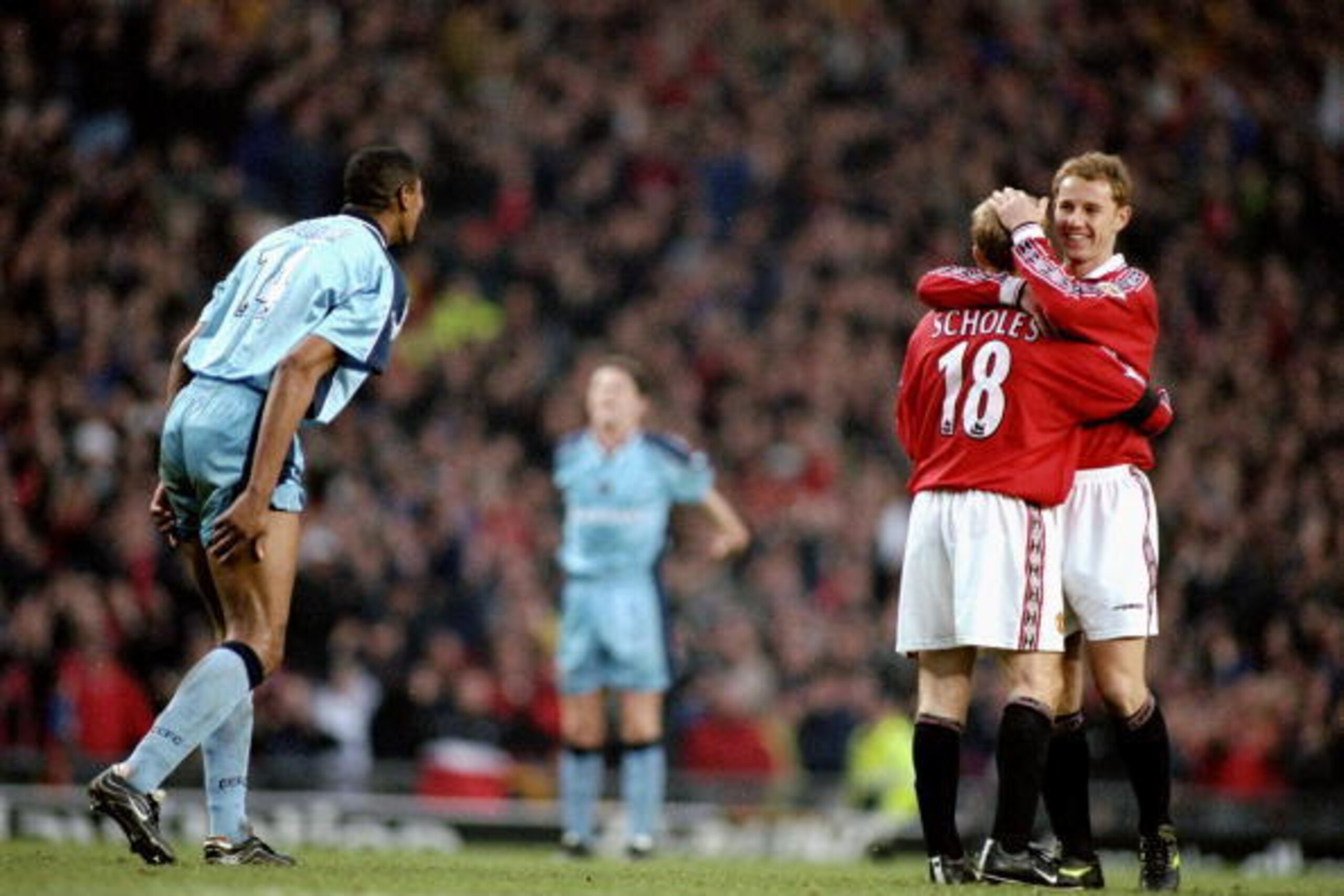 5 Feb 2000:  Nicky Butt of Manchester United congratulates Paul Scholes during the FA Carling Premier League match against Coventry City played at Old Trafford in Manchester, England. United won the game 3-2. \ Mandatory Credit: Clive Mason /Allsport