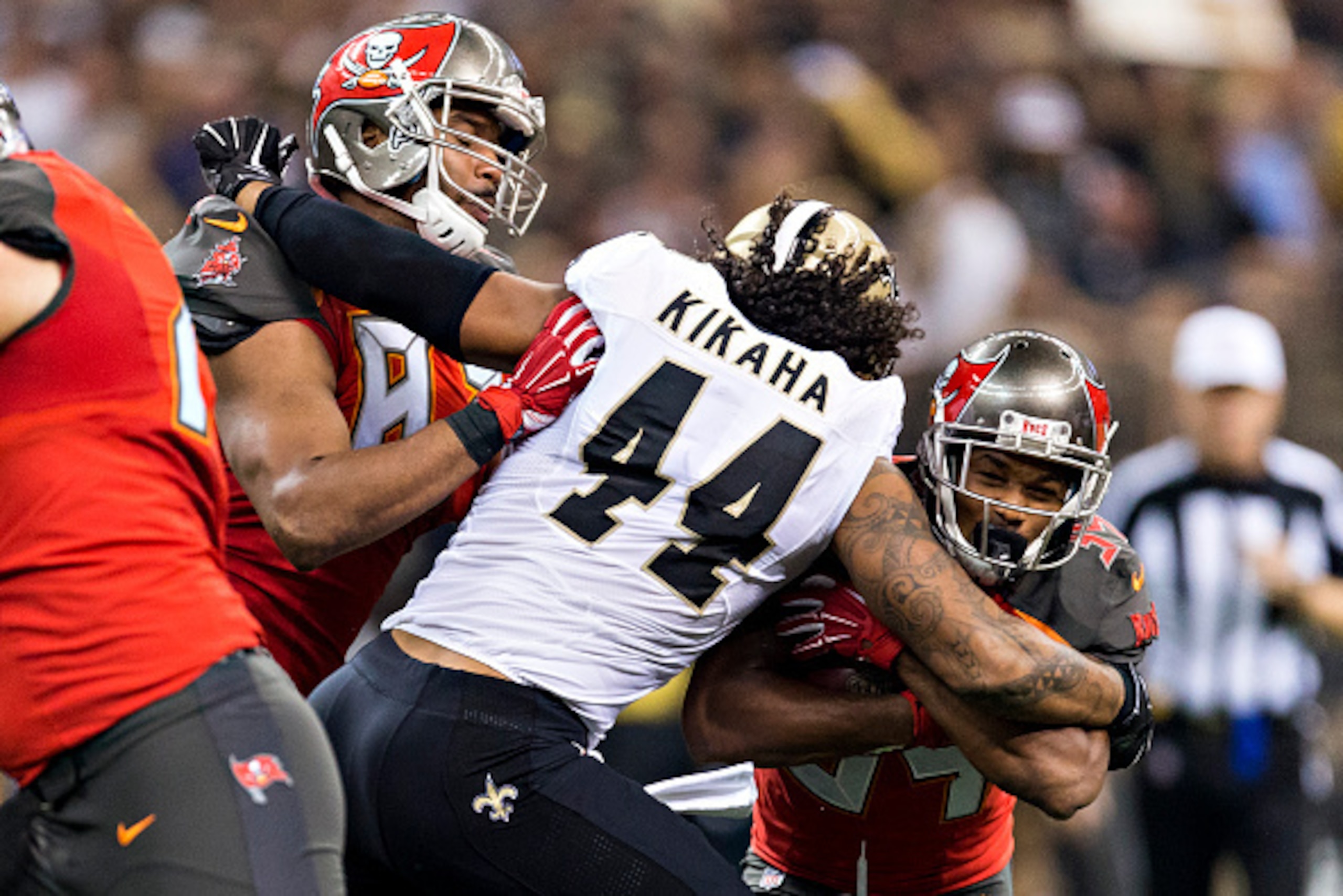 NEW ORLEANS, LA - SEPTEMBER 20:  Charles Sims #34 of the Tampa Bay Buccaneers is tackled by Hau'oli Kikaha #44 of the New Orleans Saints at Mercedes-Benz Superdome on September 20, 2015 in New Orleans Louisiana.  The Buccaneers defeated the Saints 26-19. 