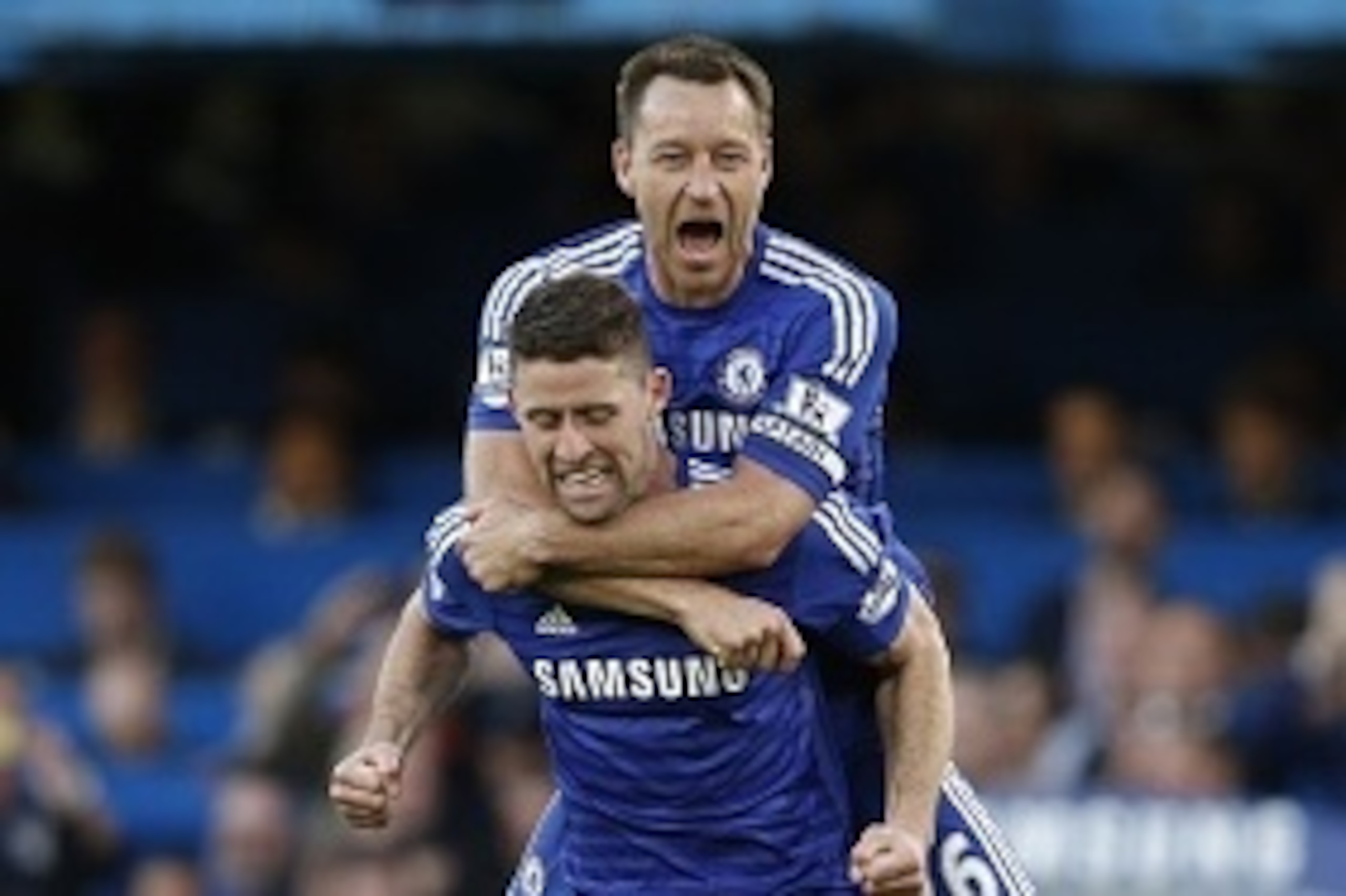 Chelsea's English defender John Terry (top) and Chelsea's English defender Gary Cahill (bottom) celebrate their 1-0 victory after the final whistle of the English Premier League football match between Chelsea and Manchester United at Stamford Bridge in Lo
