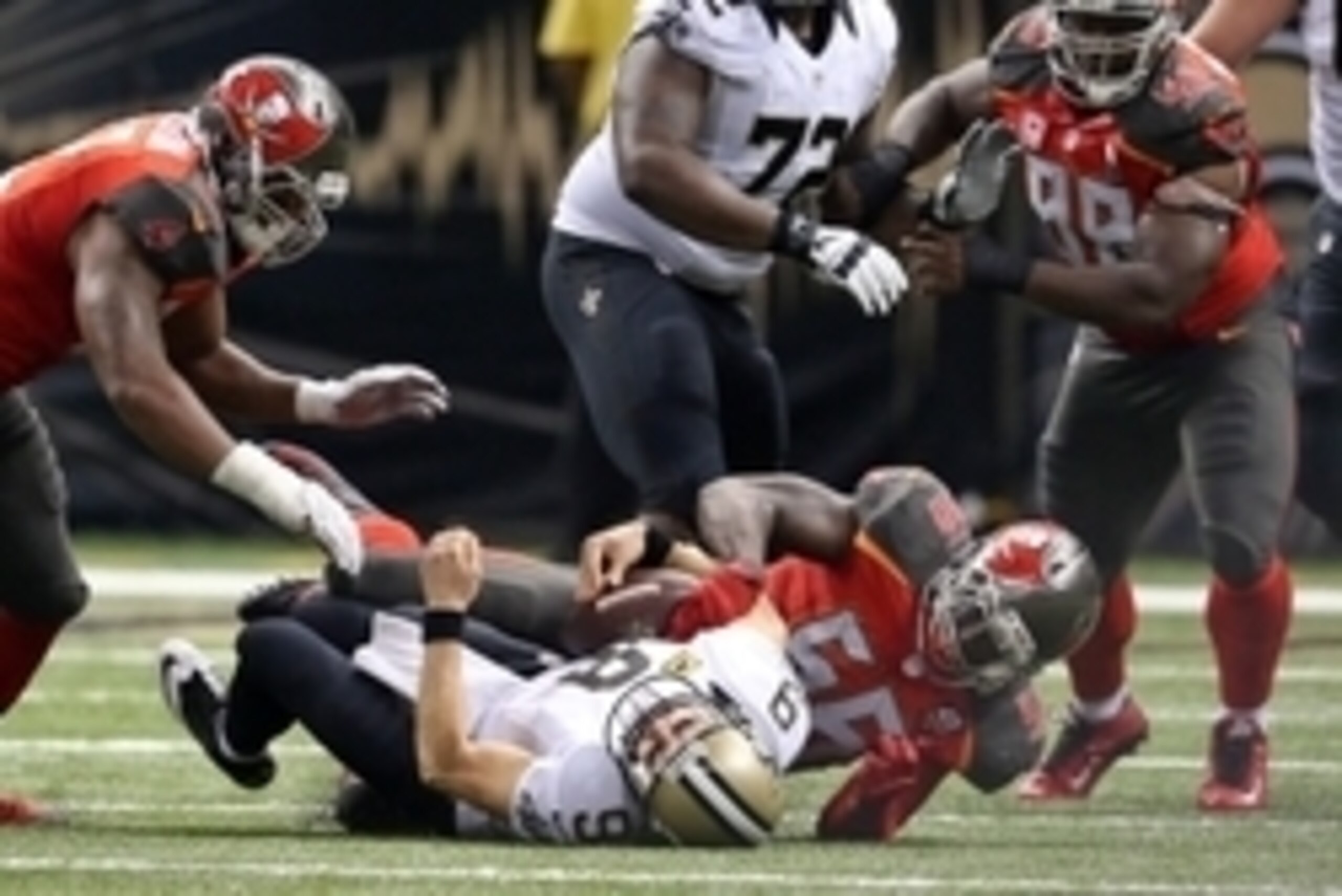 Sep 20, 2015; New Orleans, LA, USA; New Orleans Saints quarterback Drew Brees (9) is sacked by Tampa Bay Buccaneers defensive end Jacquies Smith (56) in the second half at the Mercedes-Benz Superdome. The Tampa Bay Buccaneers won, 23-19.Mandatory Credit: 