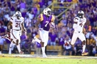 Oct 10, 2015; Baton Rouge, LA, USA; LSU Tigers running back Leonard Fournette (7) runs for an 87-yard touchdown during the third quarter of a game against the South Carolina Gamecocks at Tiger Stadium.  Mandatory Credit: Derick E. Hingle-USA TODAY Sports