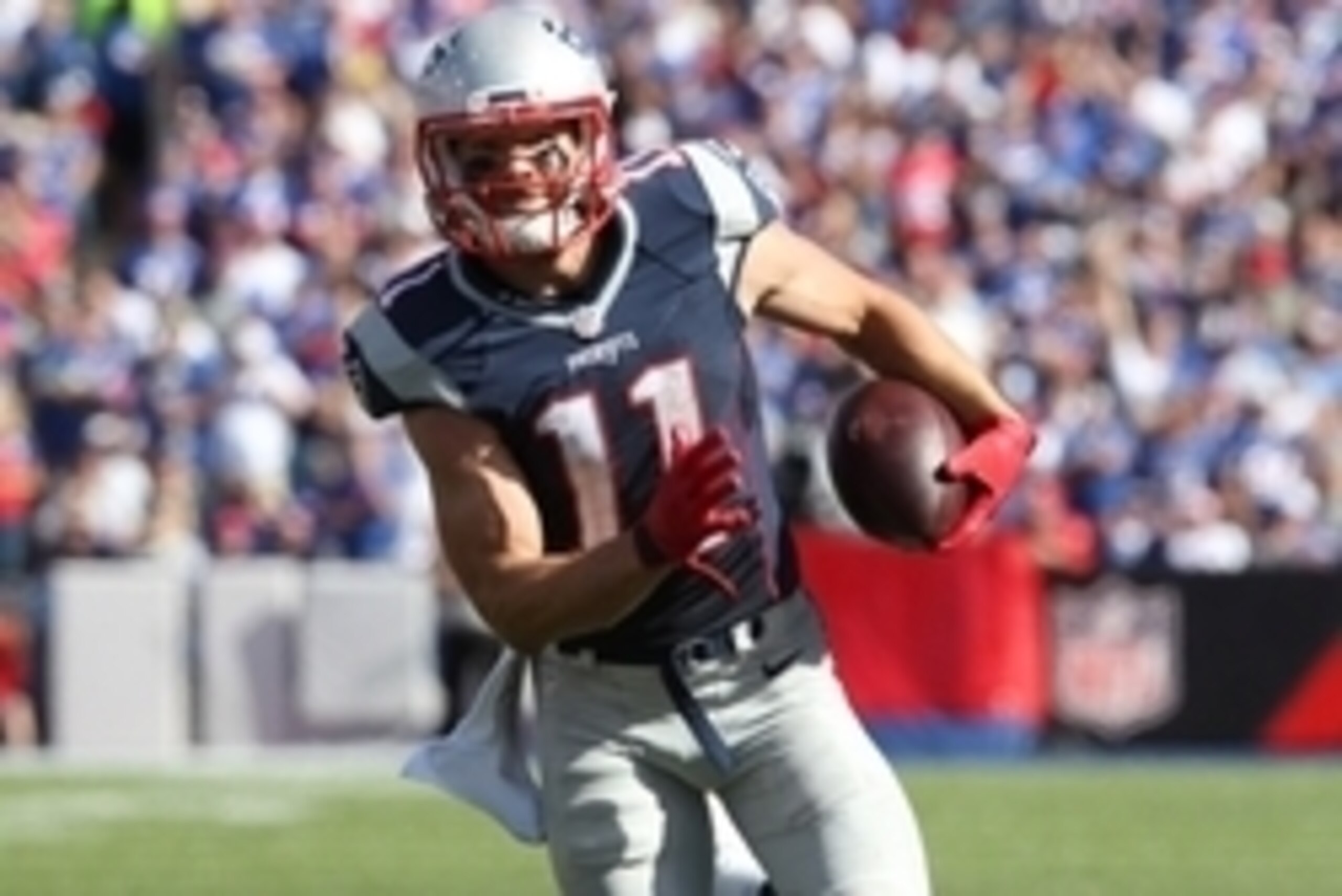 Sep 20, 2015; Orchard Park, NY, USA; New England Patriots wide receiver Julian Edelman (11) runs the ball after a catch during the second half against the Buffalo Bills at Ralph Wilson Stadium. Patriots defeat the Bills 40 to 32.  Mandatory Credit: Timoth