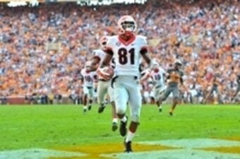 Oct 10, 2015; Knoxville, TN, USA; Georgia Bulldogs wide receiver Reggie Davis (81) runs for a touchdown on a punt return during the first half against the Tennessee Volunteers at Neyland Stadium. Mandatory Credit: Jim Brown-USA TODAY Sports