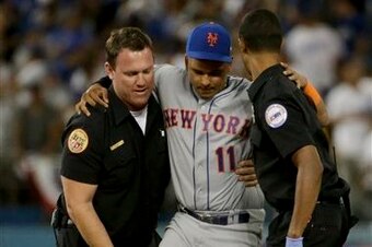 Ruben Tejada had to be helped onto the cart that was to take him from the field.