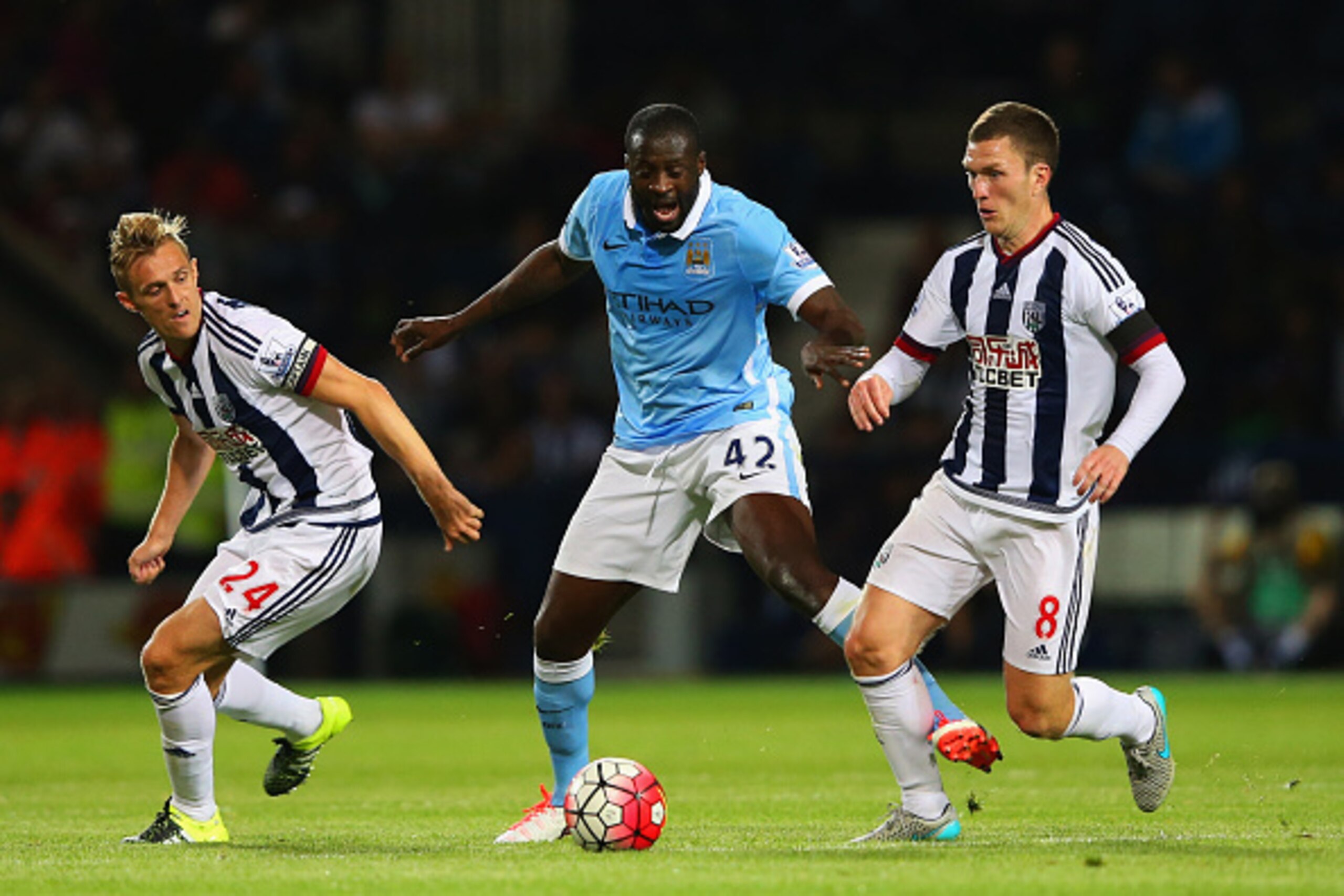 WEST BROMWICH, ENGLAND - AUGUST 10:  Yaya Toure of Manchester City battles with Darren Fletcher (24) and Craig Gardner of West Bromwich Albion (8) during the Barclays Premier League match between West Bromwich Albion and Manchester City at The Hawthorns o