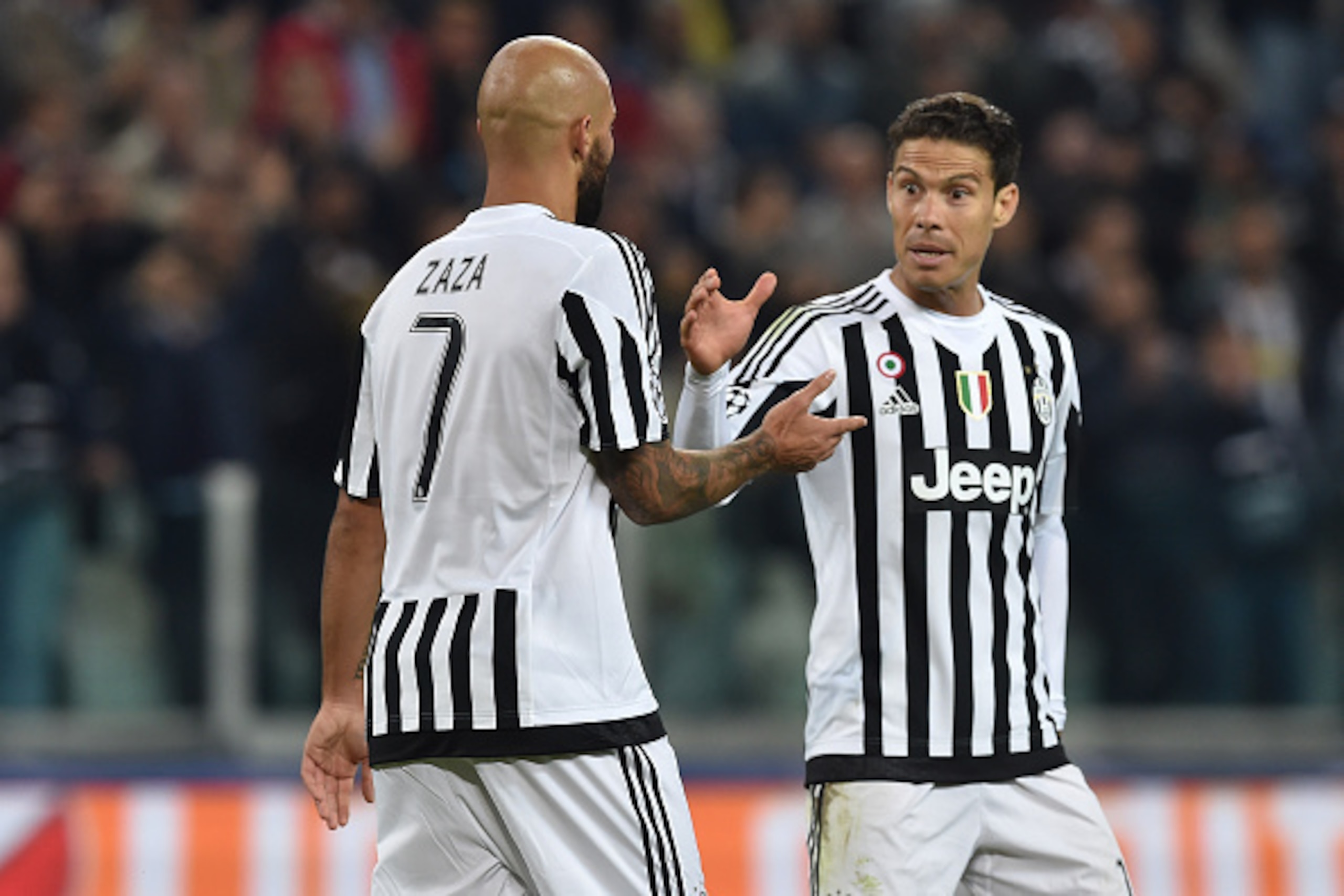TURIN, ITALY - SEPTEMBER 30:  Simone Zaza (L) of Juventus celebrates a goal with team mate Anderson Hernanes during the UEFA Champions League group E match between Juventus and Sevilla FC on September 30, 2015 in Turin, Italy.  (Photo by Valerio Pennicino