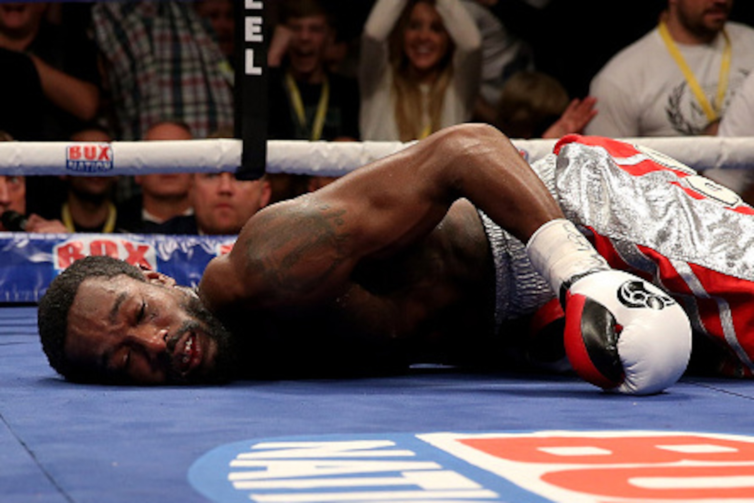 MANCHESTER, ENGLAND - OCTOBER 10: John Thompson of The USA lies on the canvas after being knocked down by Liam Smith of Great Britain leading to the end of the contest during their WBO World Super Welterweight championship bout at Manchester Arena on Oct MANCHESTER, ENGLAND - OCTOBER 10: John Thompson of The USA lies on the canvas after being knocked down by Liam Smith of Great Britain leading to the end of the contest during their WBO World Super Welterweight championship bout at Manchester Arena on Oct