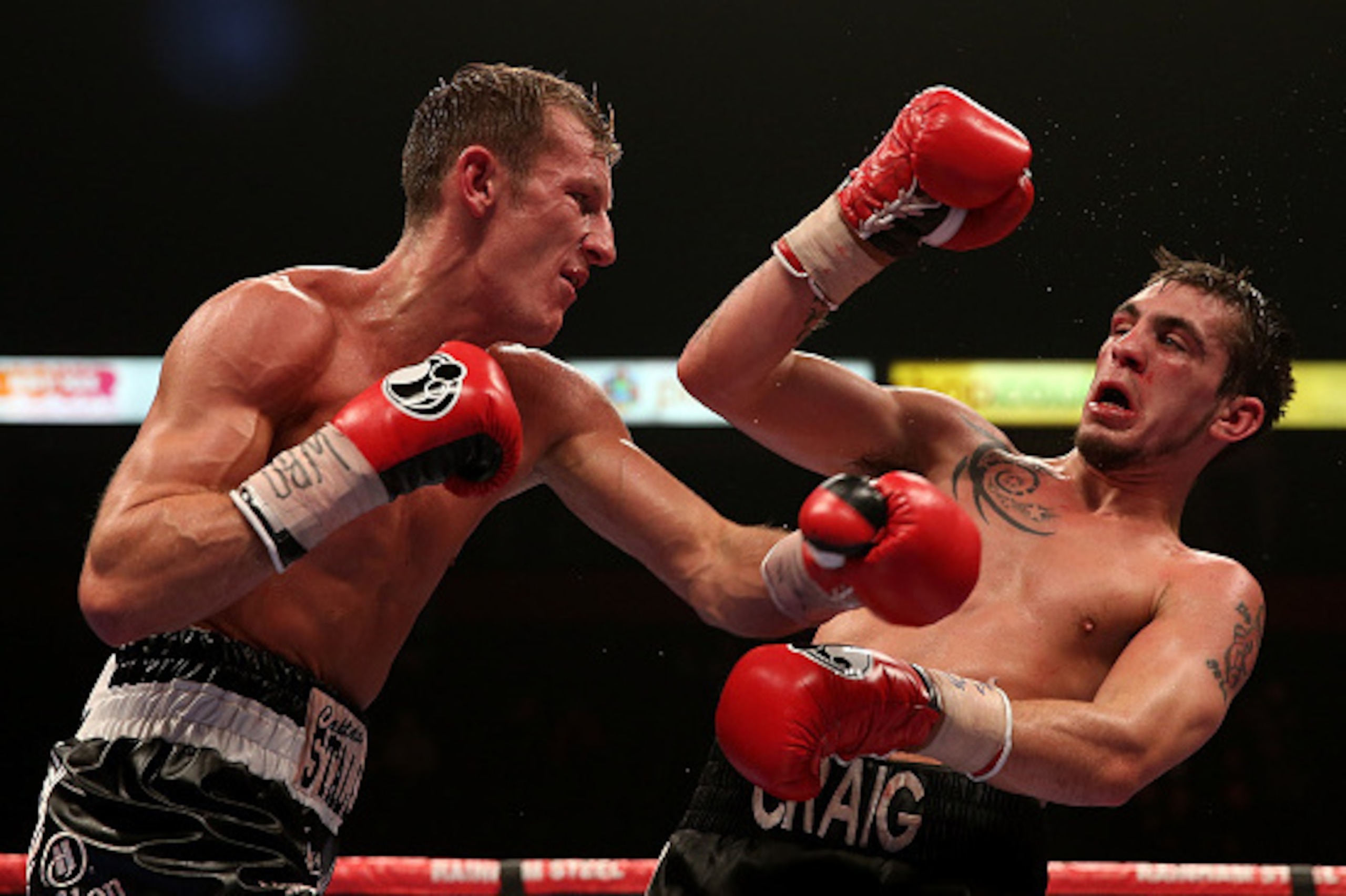MANCHESTER, ENGLAND - OCTOBER 10: Tom Stalker of Great Britain and Craig Evans of Great Britain exchange blows during their bout for the vacant WBO European Lightweight Championship at Manchester Arena on October 10, 2015 in Manchester, England. (Photo MANCHESTER, ENGLAND - OCTOBER 10: Tom Stalker of Great Britain and Craig Evans of Great Britain exchange blows during their bout for the vacant WBO European Lightweight Championship at Manchester Arena on October 10, 2015 in Manchester, England. (Photo