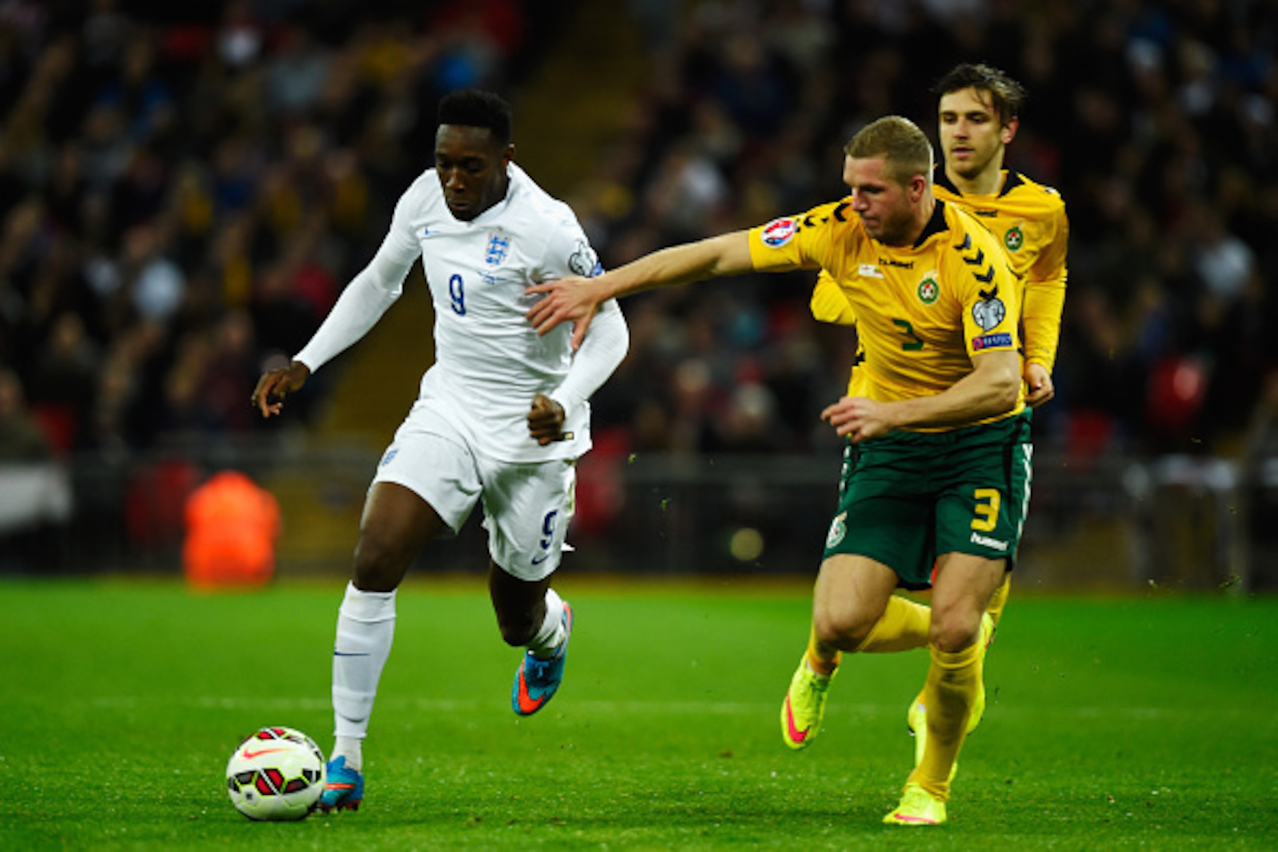 LONDON, ENGLAND - MARCH 27:  Danny Welbeck of England is tackled by Georgas Freidgeimas of Lithuania during the EURO 2016 Qualifier match between England and Lithuania at Wembley Stadium on March 27, 2015 in London, England.  (Photo by Mike Hewitt/Getty I