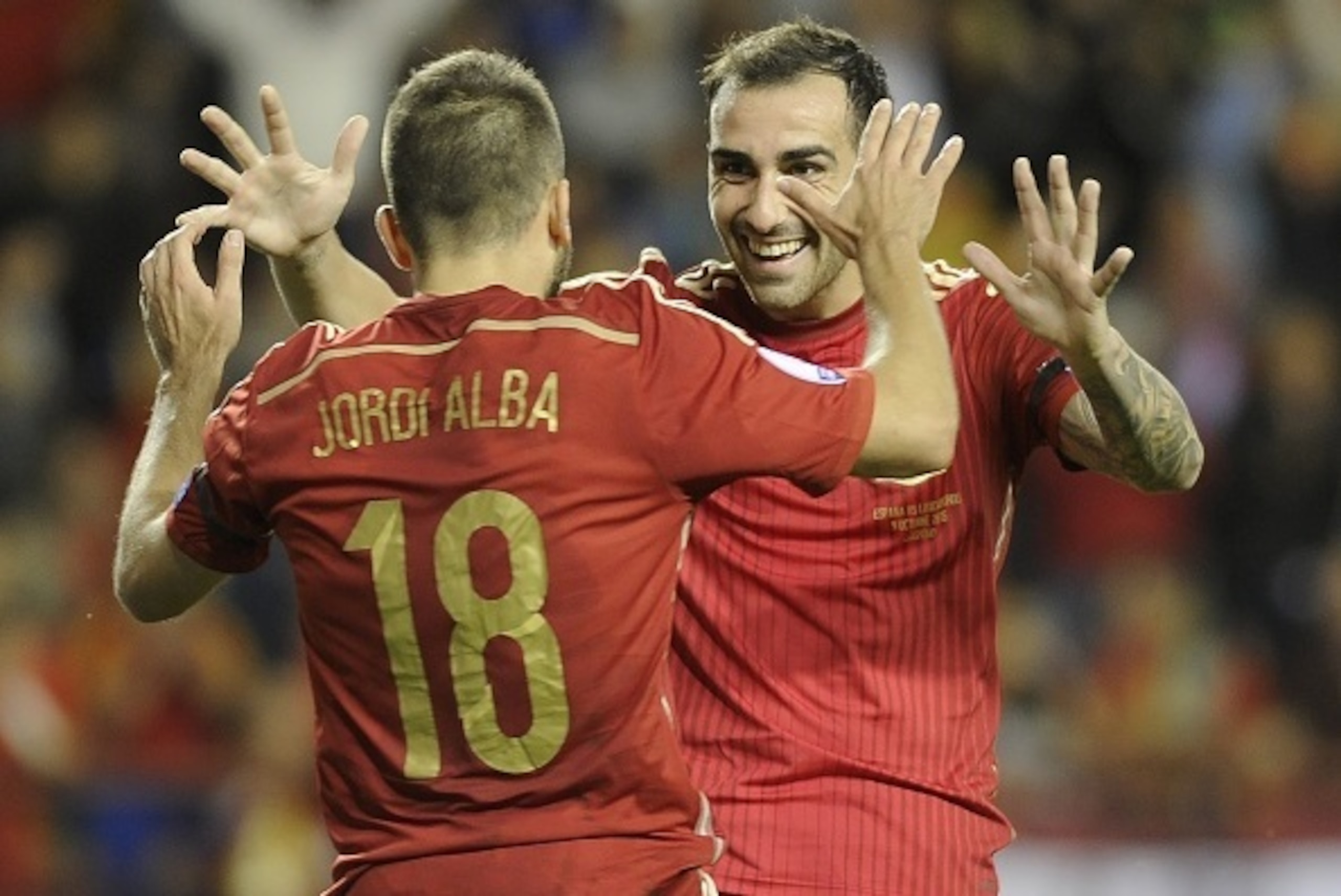 Spain's defender Jordi Alba (L) and forward Paco Alcacer celebrate after scoring during the Euro 2016 qualifying football match Spain vs Luxembourg at Las Gaunas stadium in Logrono on October 9, 2015. AFP PHOTO/  ANDER GILLENEA        (Photo credit should