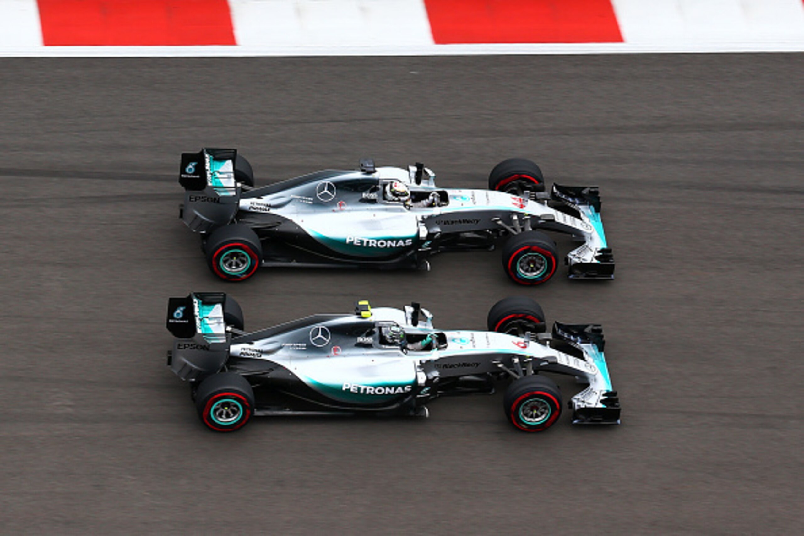 SOCHI, RUSSIA - OCTOBER 11: Lewis Hamilton of Great Britain and Mercedes GP and Nico Rosberg of Germany and Mercedes GP race into the first corner during the Formula One Grand Prix of Russia at Sochi Autodrom on October 11, 2015 in Sochi, Russia. (Photo SOCHI, RUSSIA - OCTOBER 11: Lewis Hamilton of Great Britain and Mercedes GP and Nico Rosberg of Germany and Mercedes GP race into the first corner during the Formula One Grand Prix of Russia at Sochi Autodrom on October 11, 2015 in Sochi, Russia. (Photo