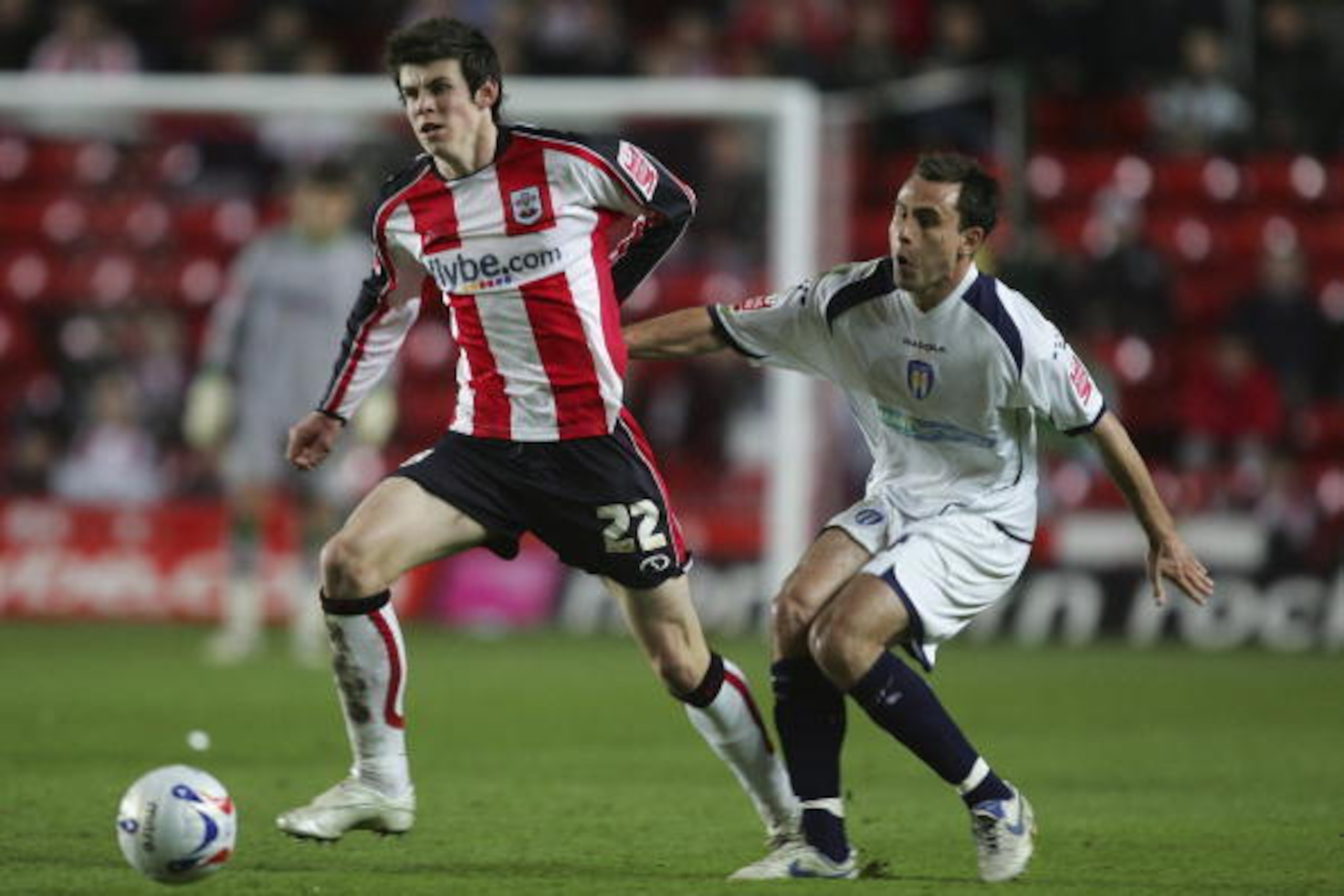 SOUTHAMPTON, UNITED KINGDOM - MARCH 16:  Gareth Bale of Southampton battles with Richard Garcia of Colchester during the Coca-Cola Championship match between Southampton and Colchester United at St Mary's Stadium on March 16, 2007 in Southampton, England.