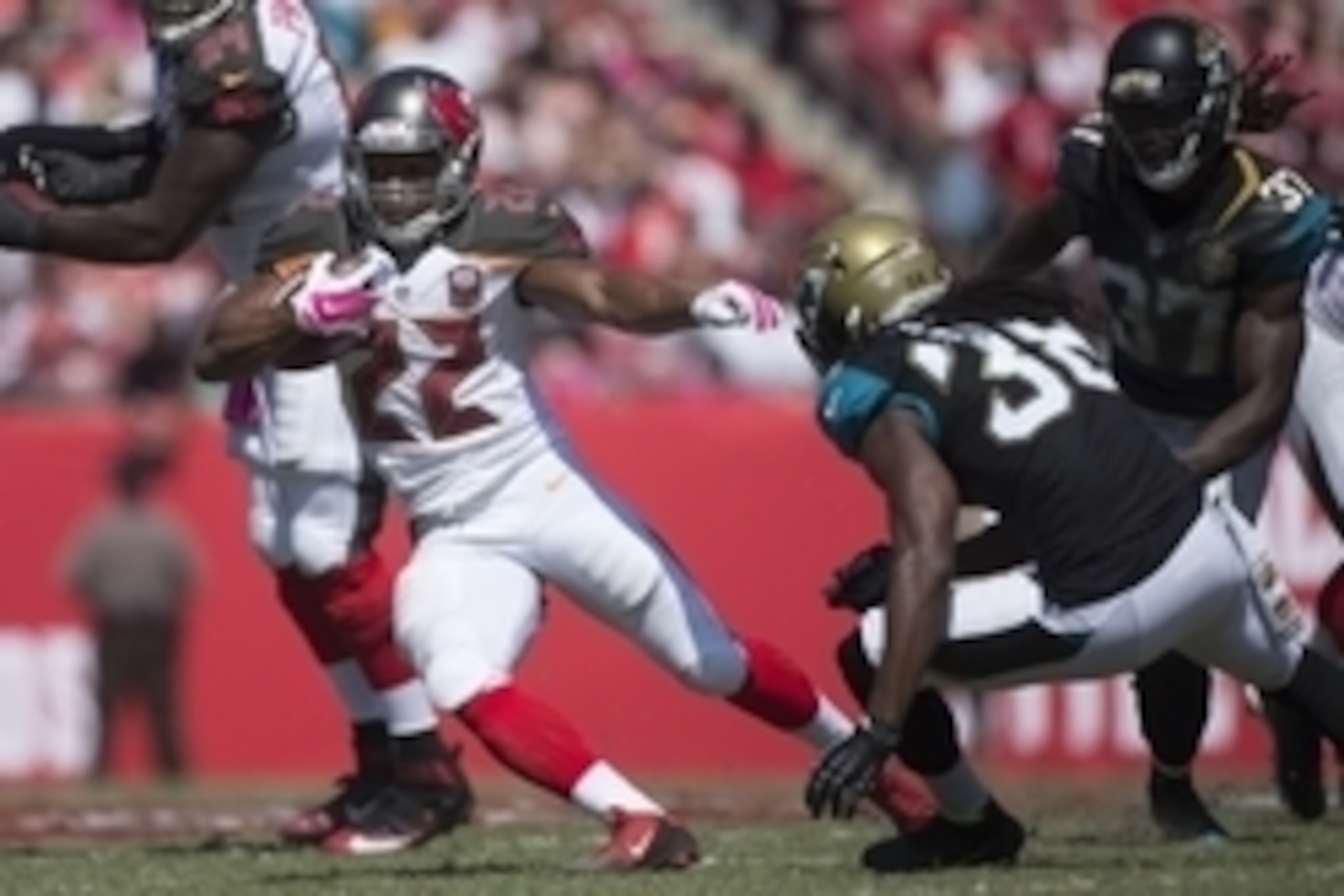 Oct 11, 2015; Tampa, FL, USA; Tampa Bay Buccaneers running back Doug Martin (22) runs during the second quarter against the Jacksonville Jaguars at Raymond James Stadium. Mandatory Credit: Logan Bowles-USA TODAY Sports