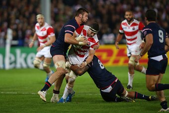 GLOUCESTER, ENGLAND - OCTOBER 11:  Luke Thompson of Japan is tackled by Samu Manoa of the United States during the 2015 Rugby World Cup Pool B match between USA and Japan at Kingsholm Stadium on October 11, 2015 in Gloucester, United Kingdom.  (Photo by B