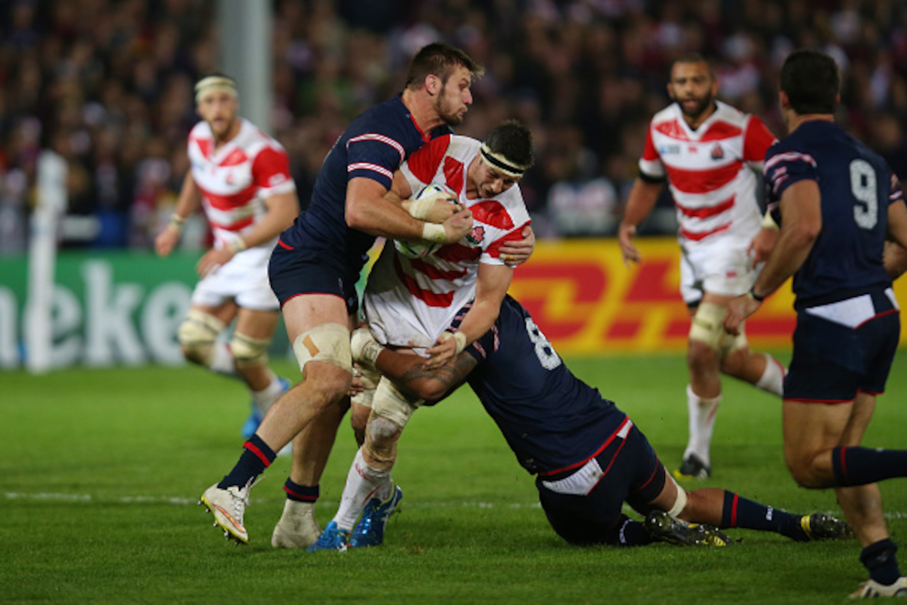 GLOUCESTER, ENGLAND - OCTOBER 11:  Luke Thompson of Japan is tackled by Samu Manoa of the United States during the 2015 Rugby World Cup Pool B match between USA and Japan at Kingsholm Stadium on October 11, 2015 in Gloucester, United Kingdom.  (Photo by B