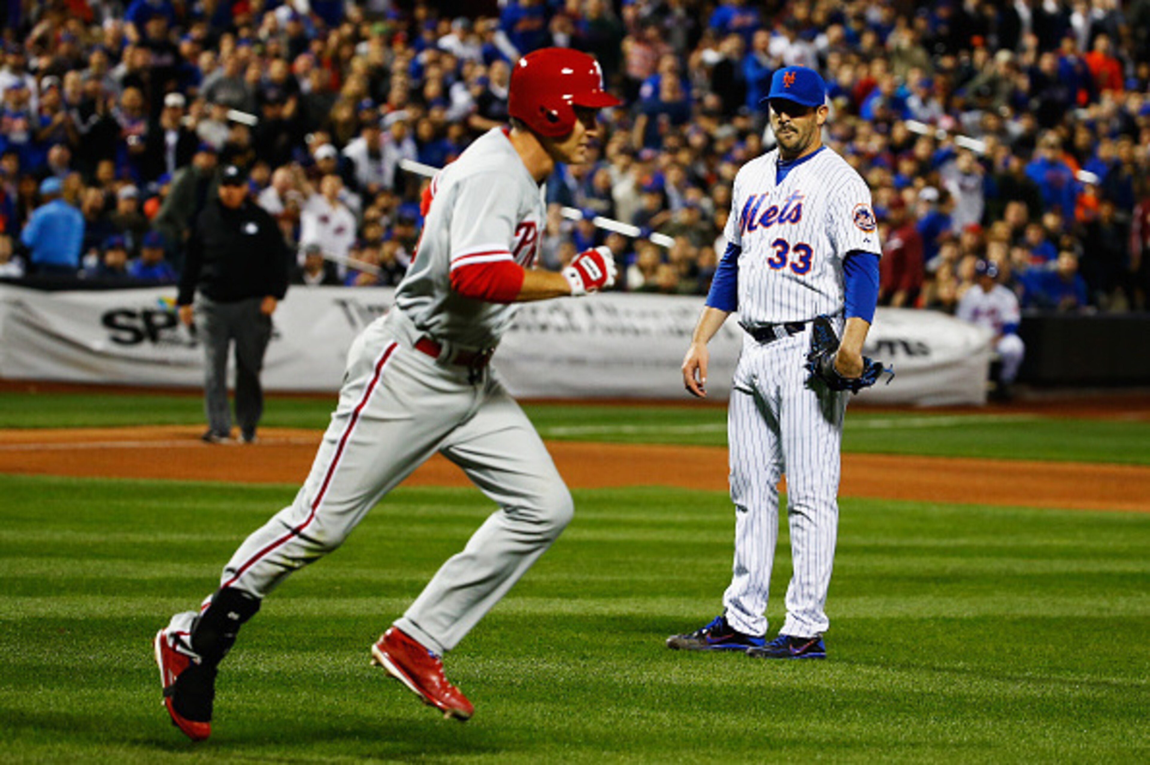 NEW YORK, NY - APRIL 14:  Matt Harvey #33 of the New York Mets watches Chase Utley #26 of the Philadelphia Phillies take first base after he was hit by Harvey in the fifth inning during their game at Citi Field on April 14, 2015 in New York City.  (Photo 