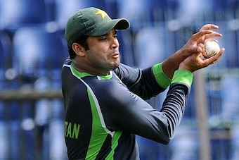 Pakistan captain Azhar Ali catches a ball during a practice session at the R. Premadasa International Cricket Stadium in Colombo on July 18, 2015.  Sri Lanka and Pakistan's third One-Day International match will be played on July 19.  AFP PHOTO/ Ishara S.