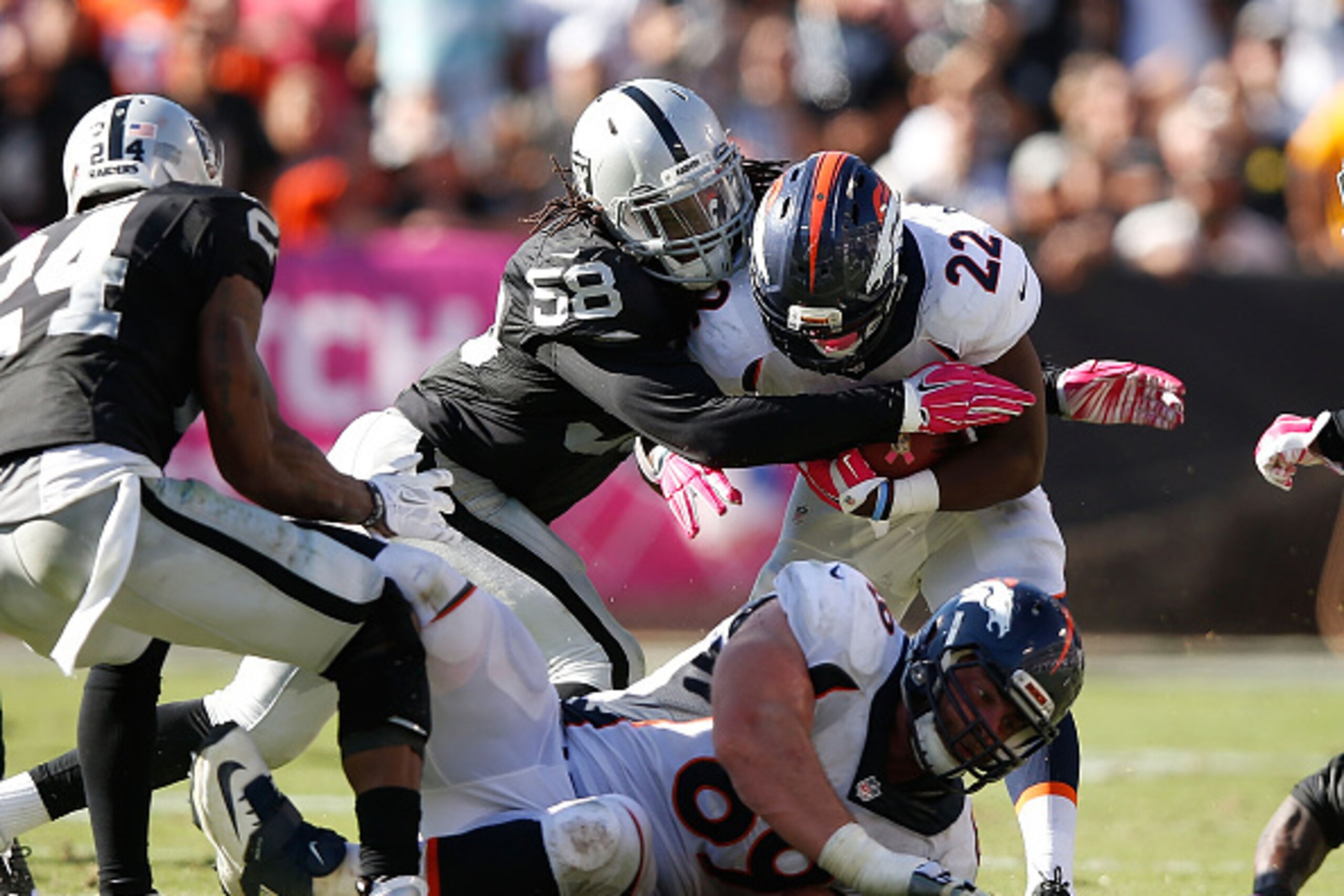 OAKLAND, CA - OCTOBER 11: Neiron Ball #58 of the Oakland Raiders applies pressure against C.J. Anderson #22 of the Denver Broncos in the fourth quarter at O.co Coliseum on October 11, 2015 in Oakland, California. (Photo by Ezra Shaw/Getty Images) OAKLAND, CA - OCTOBER 11: Neiron Ball #58 of the Oakland Raiders applies pressure against C.J. Anderson #22 of the Denver Broncos in the fourth quarter at O.co Coliseum on October 11, 2015 in Oakland, California. (Photo by Ezra Shaw/Getty Images)